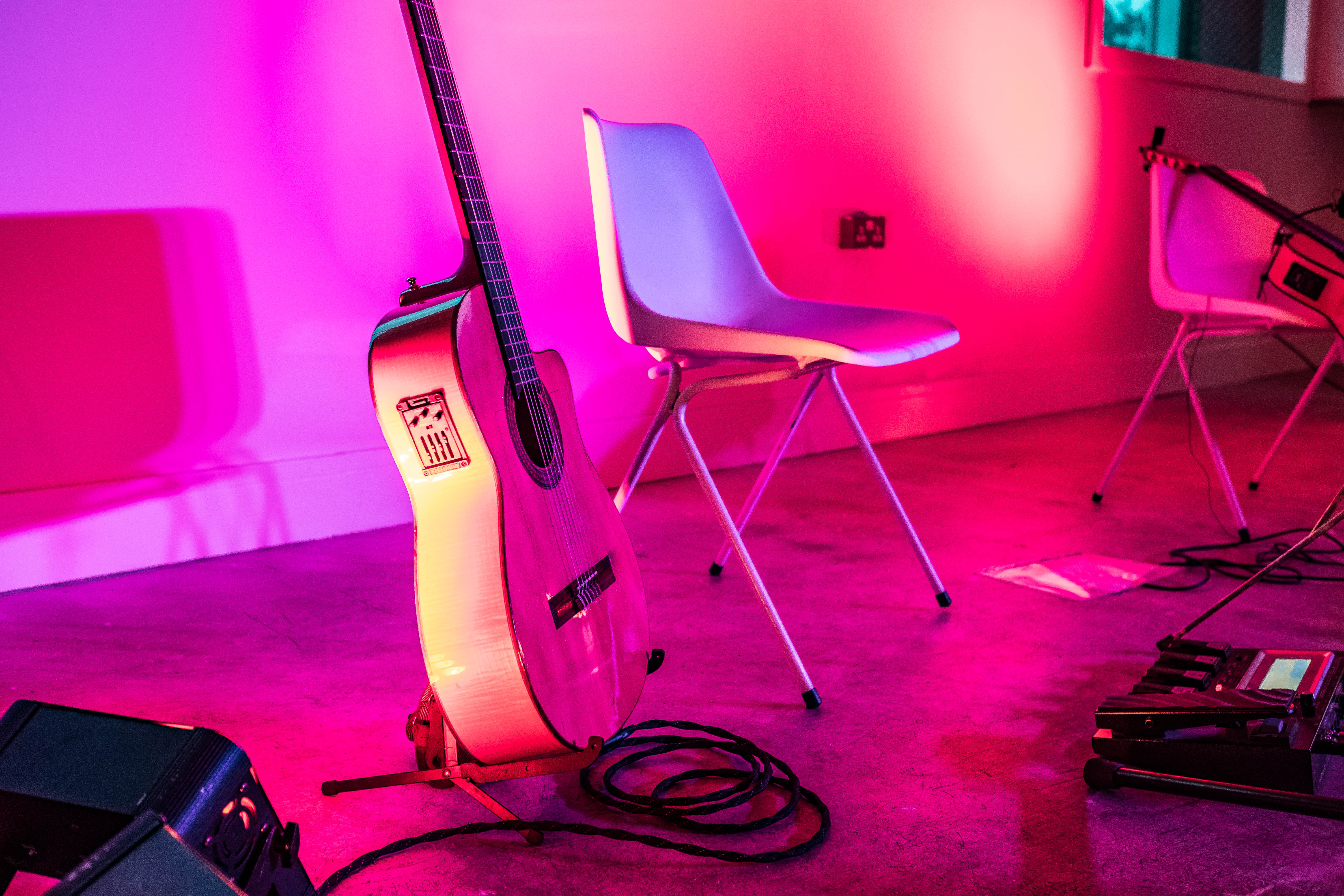Vibrant live performance setup with acoustic guitar at Peckham Gallery, ideal for events.