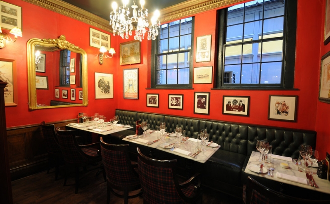 Intimate dining space with red walls for private events at Boisdale of Bishopsgate.