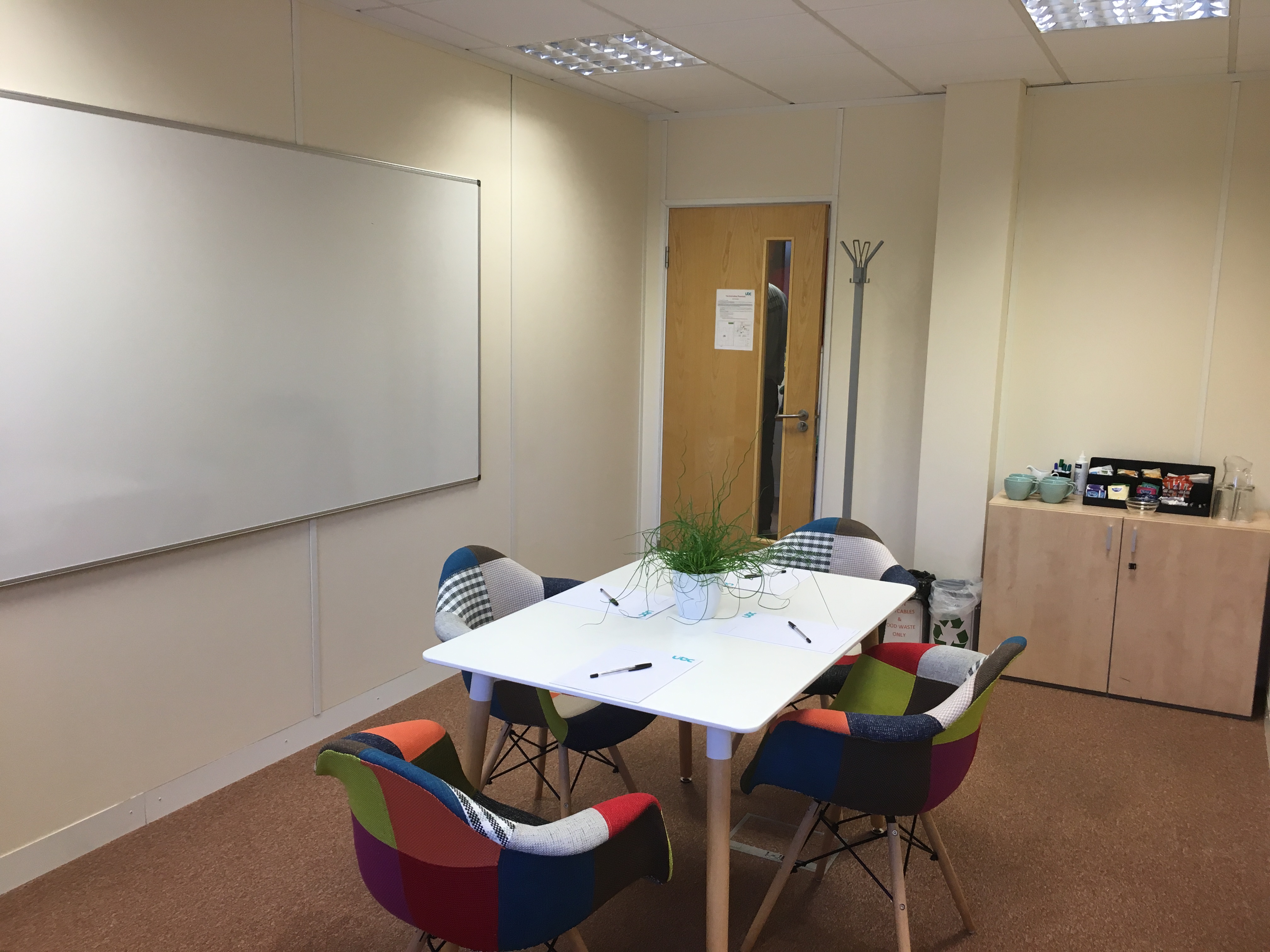 Modern meeting room at The Cow Shed, UBC Cirencester, ideal for collaboration and creativity.