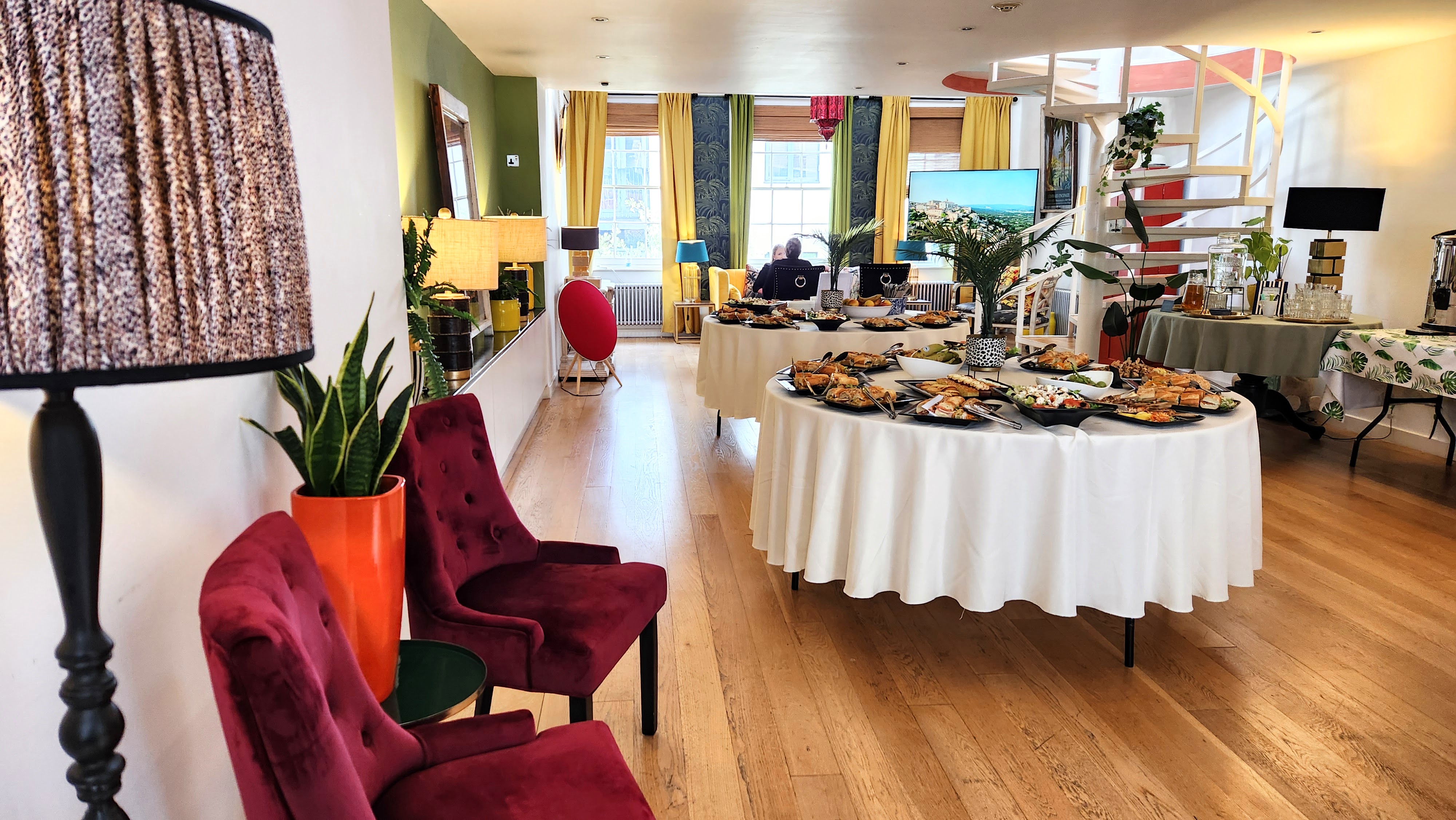 Elegant event space in Lumiere London with round tables, ideal for networking and celebrations.