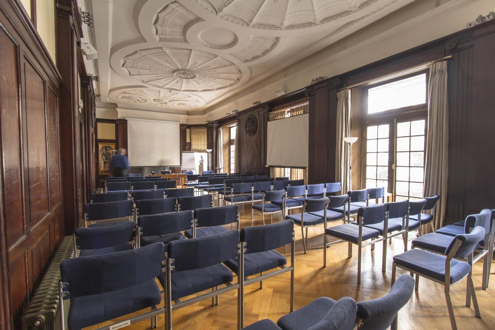 Elegant MacLaren Hall meeting room with chairs, perfect for professional presentations.