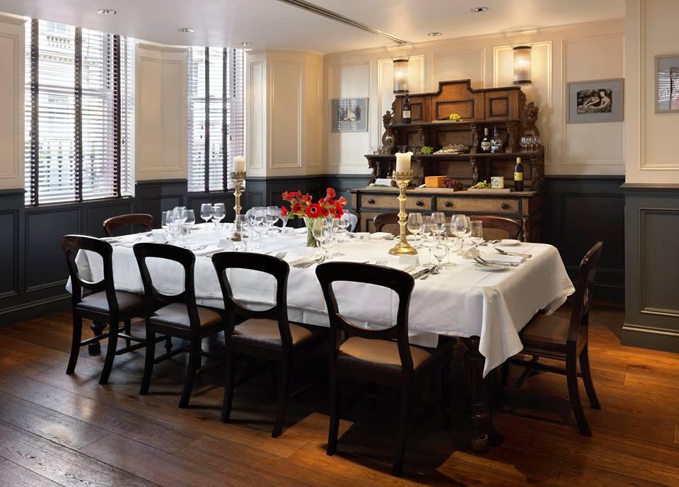Elegant private dining room at The Mandeville Hotel for intimate corporate dinners.