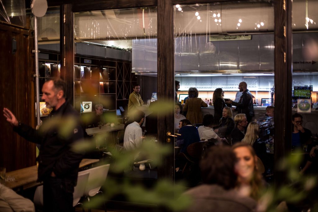 Networking event at Number 10 London, featuring vibrant conversations in a modern venue.