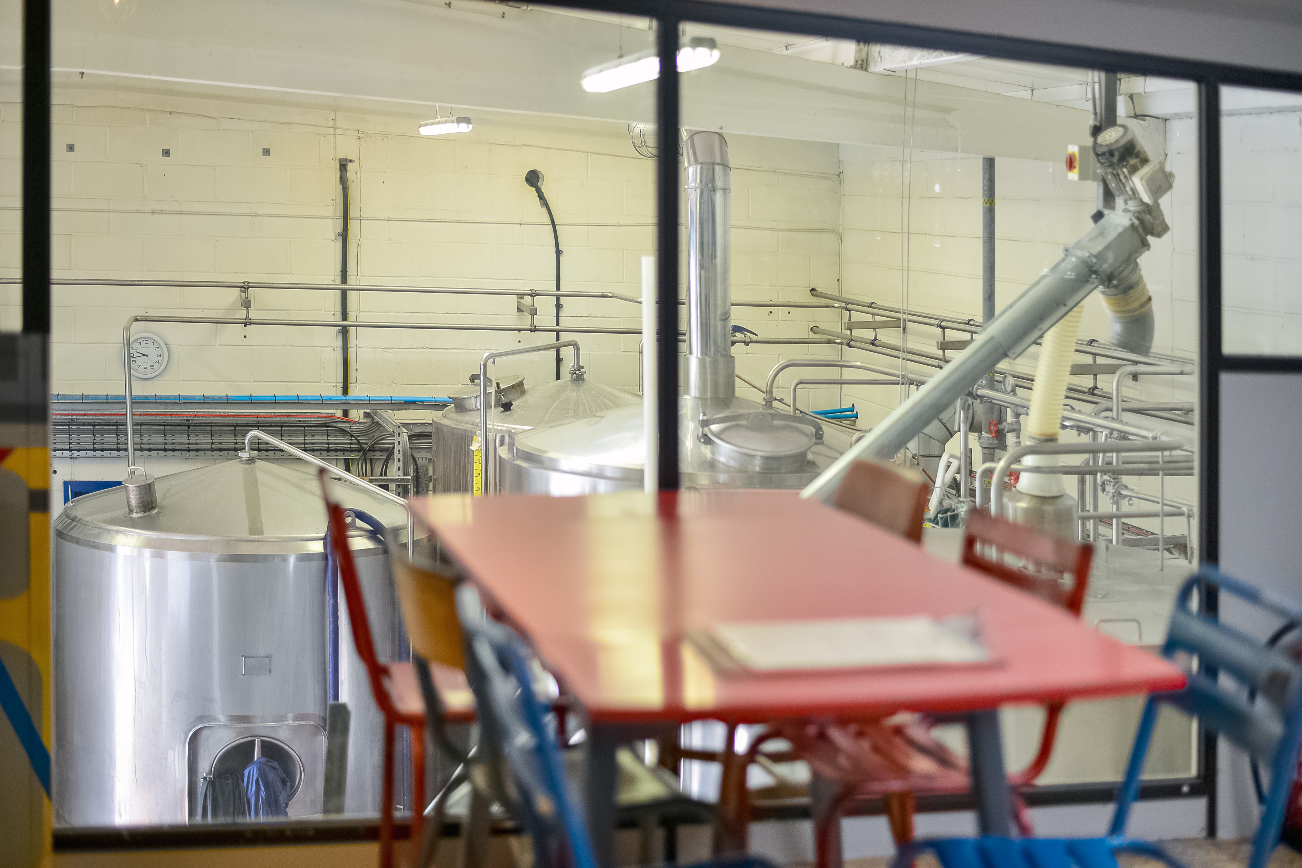 Modern Taproom at Sambrook's Brewery with stainless steel tanks, ideal for team-building events.