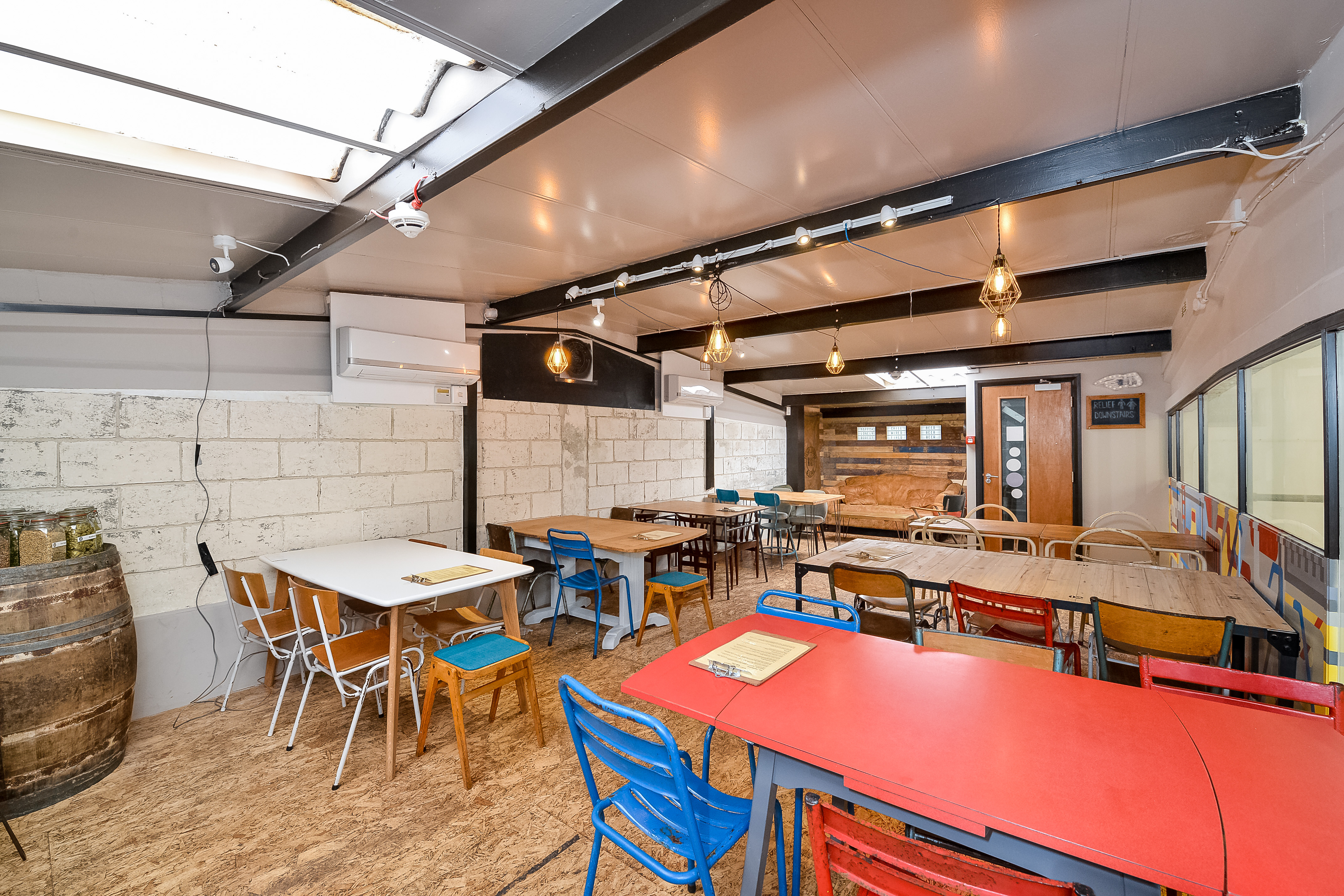 Taproom at Sambrook's Brewery: modern event space with colorful seating for workshops.