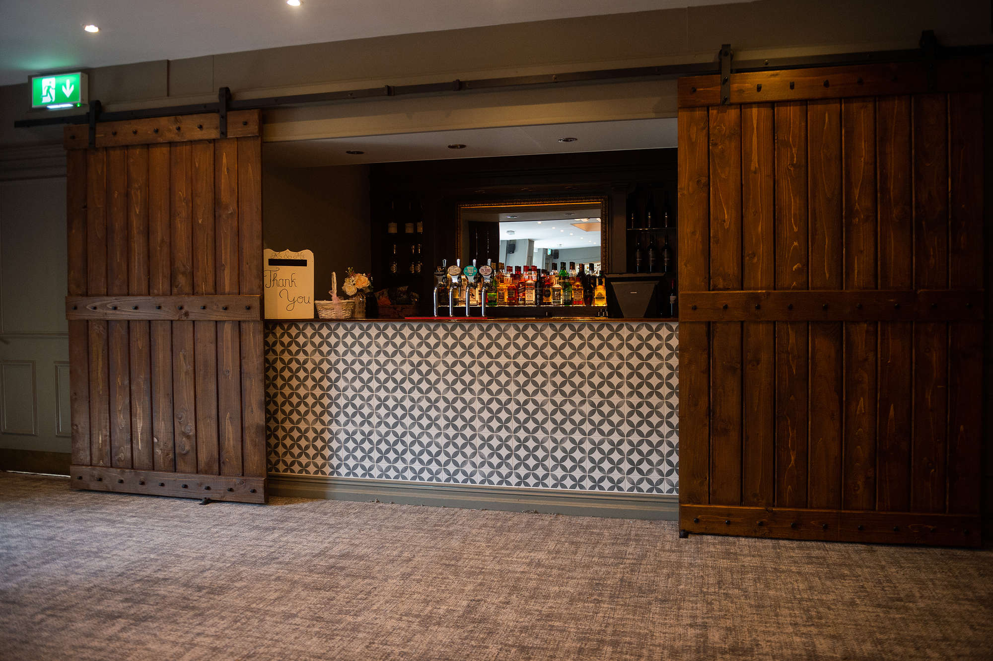 Westminster Suite bar area with rustic doors, perfect for networking events and gatherings.