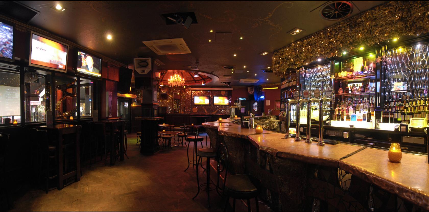 Vibrant Zoo Bar venue with warm lighting, perfect for networking events and gatherings.