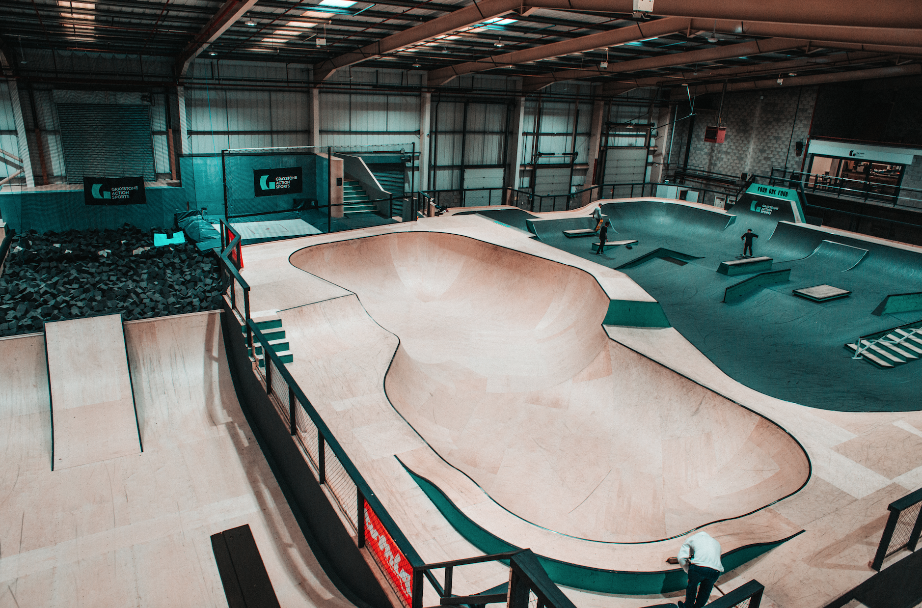 Indoor skatepark with ramps at Graystone Action Sports Academy for events and competitions.