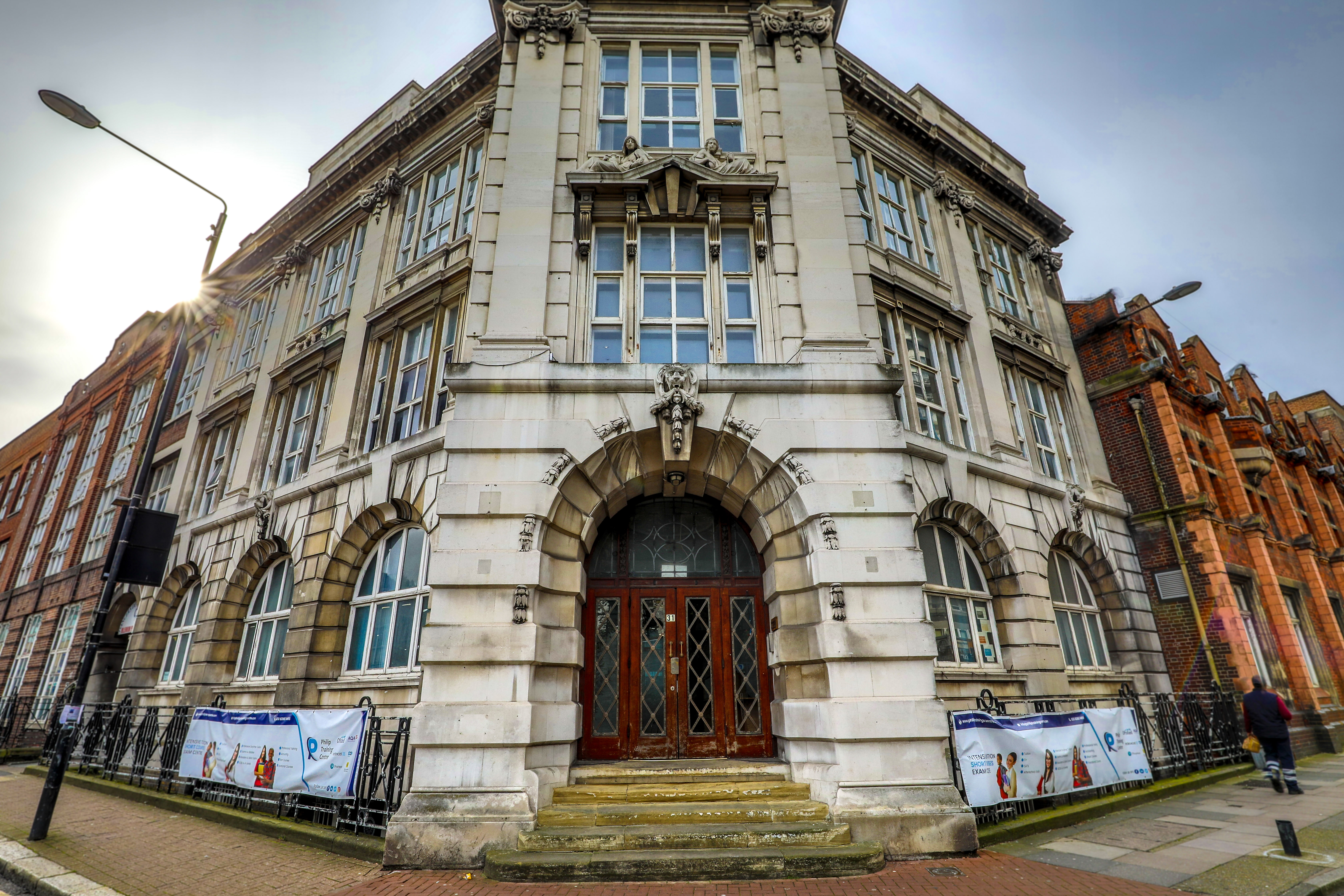 Historic conference room with large windows, ideal for corporate meetings and events.