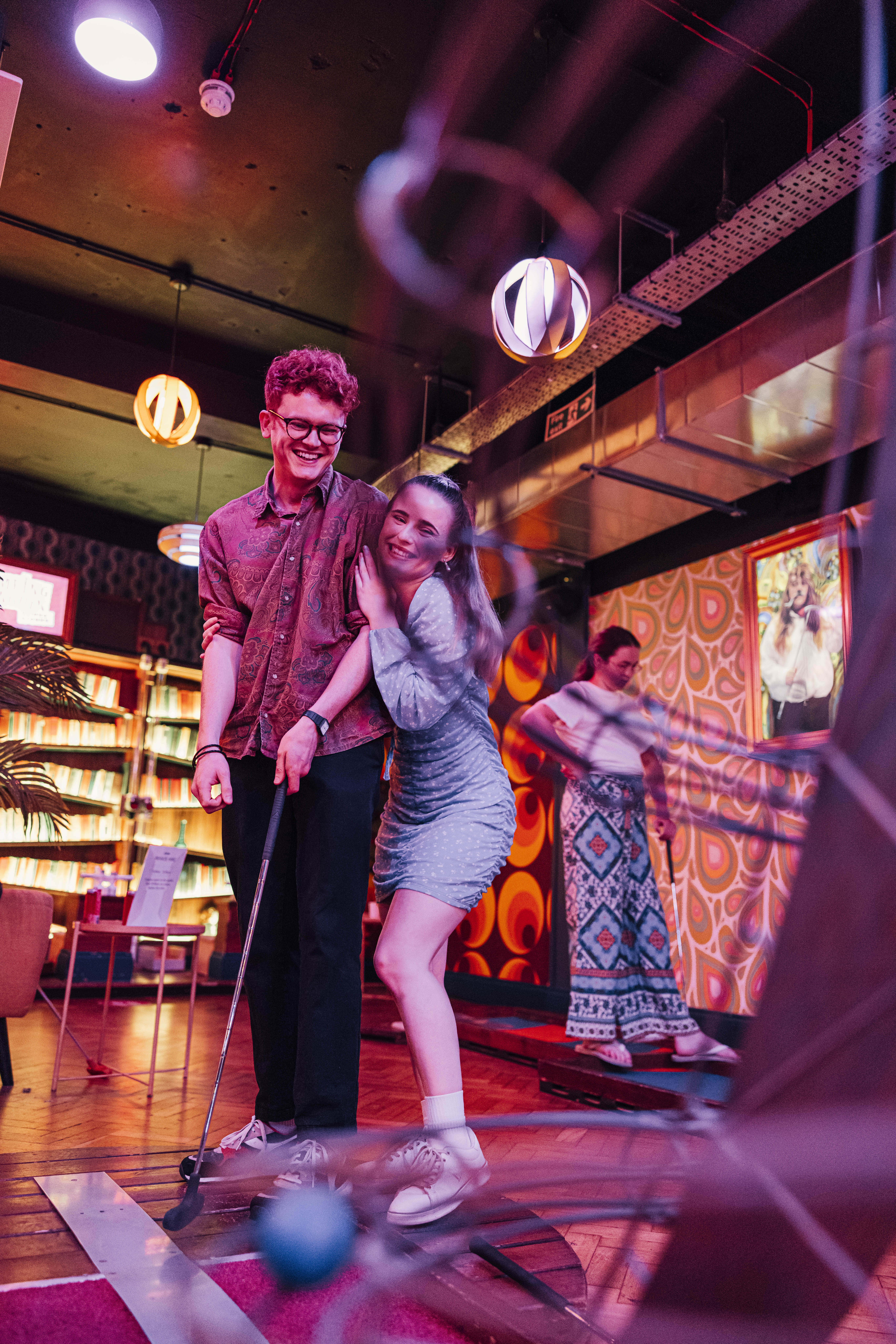 Vibrant social event at Caddies Southend with warm lighting, ideal for networking.