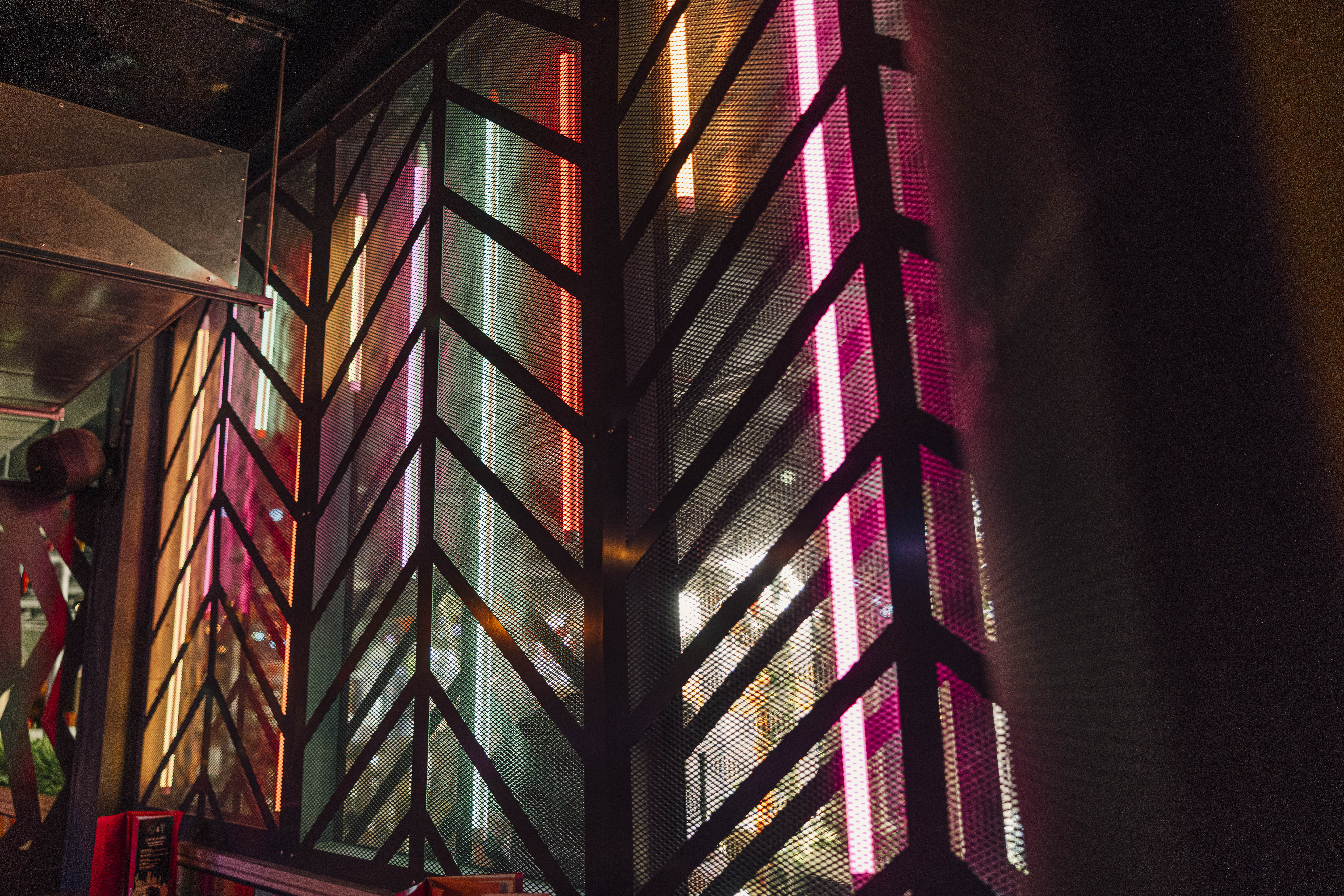 Vibrant Caddies Southend venue with neon lighting, perfect for networking events.