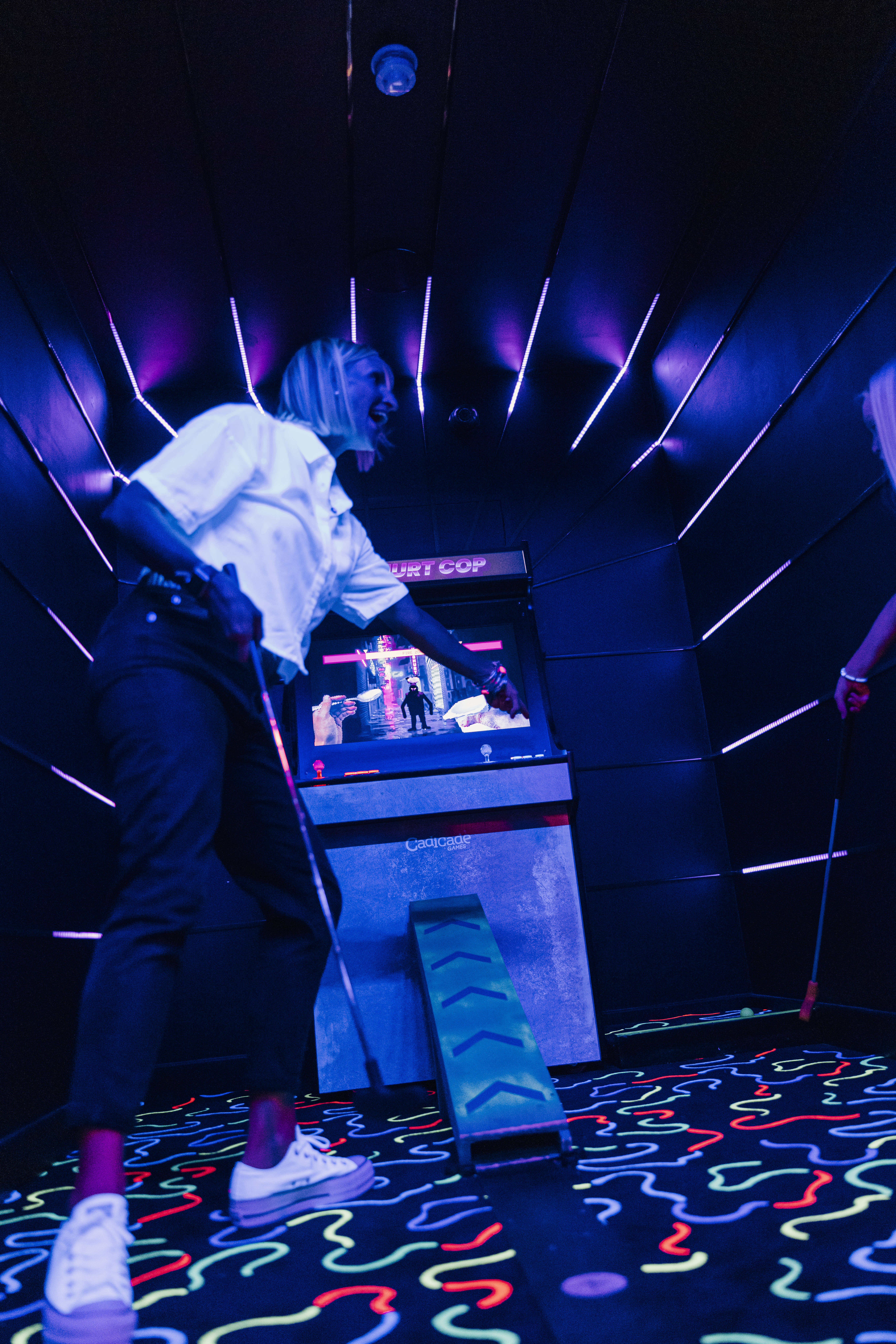 Vibrant event space with interactive gaming setup for corporate events and social gatherings.