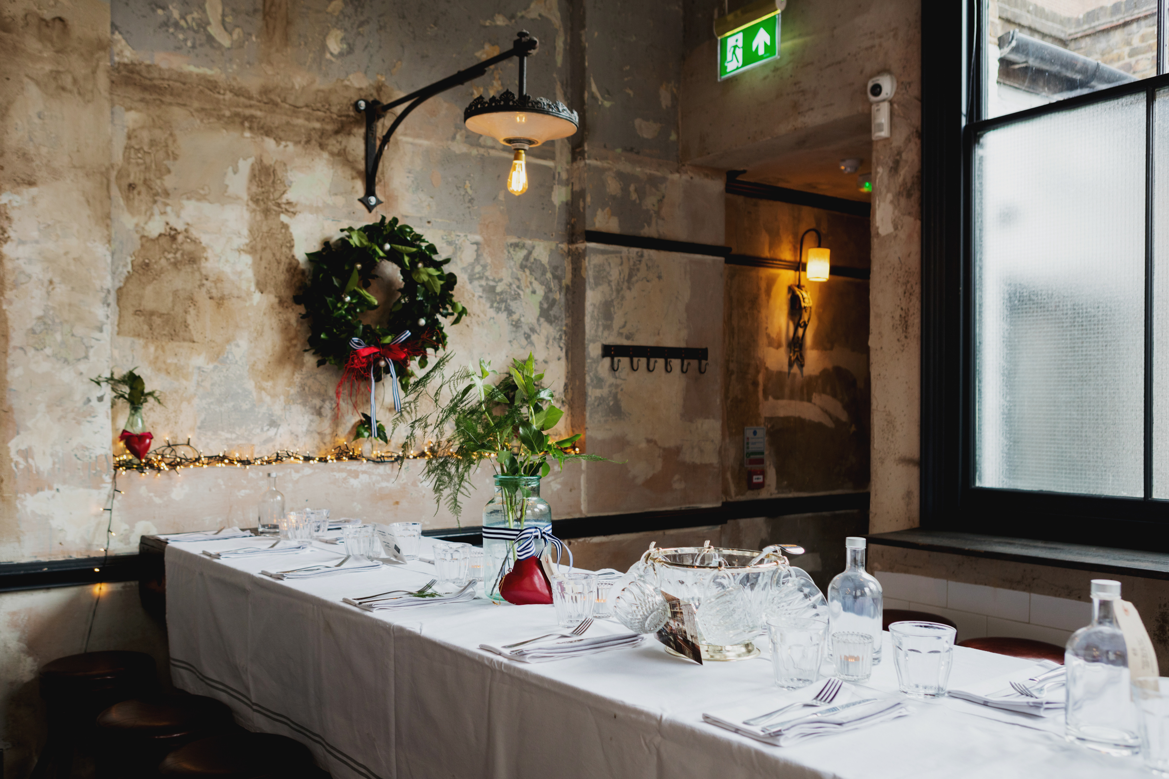 Rustic dining table with warm lighting at Martello Hall for intimate events.