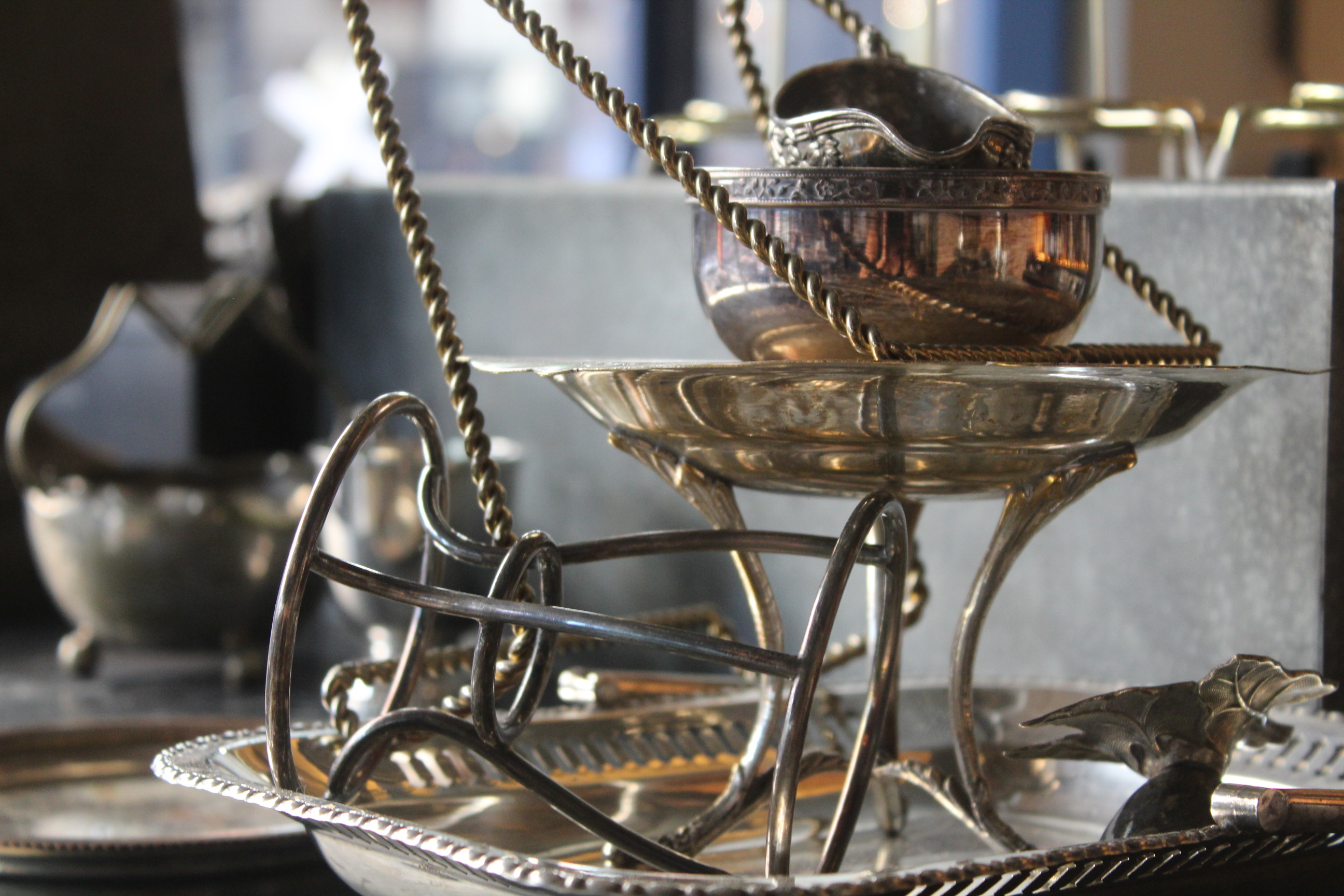 Elegant vintage silverware display at Pacifica Burger & Cocktail Bar for upscale events.