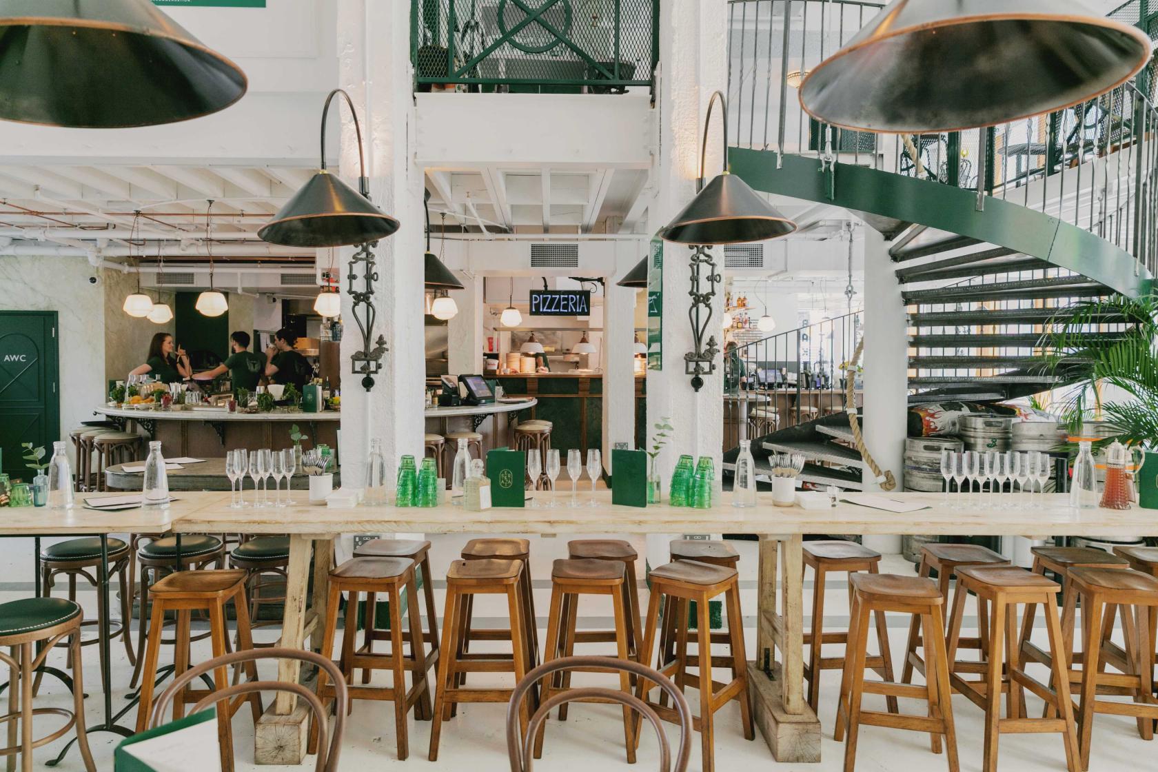 Stylish Serata Hall venue with spiral staircase, ideal for events and gatherings.