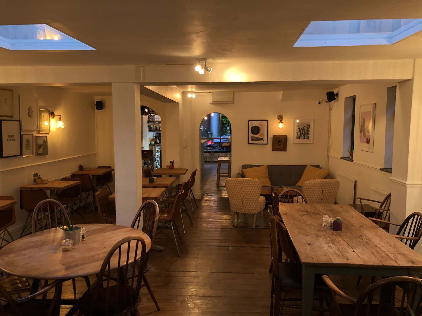 Cozy venue at Archie's with natural light, perfect for networking events and meetings.