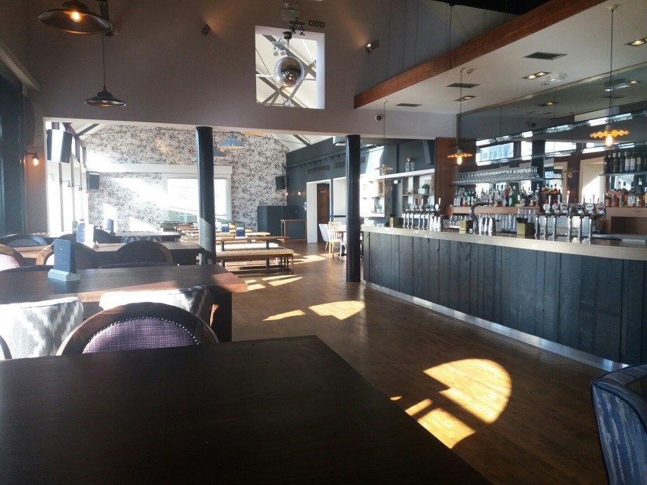 Spacious modern event venue with stylish bar and natural light in York.