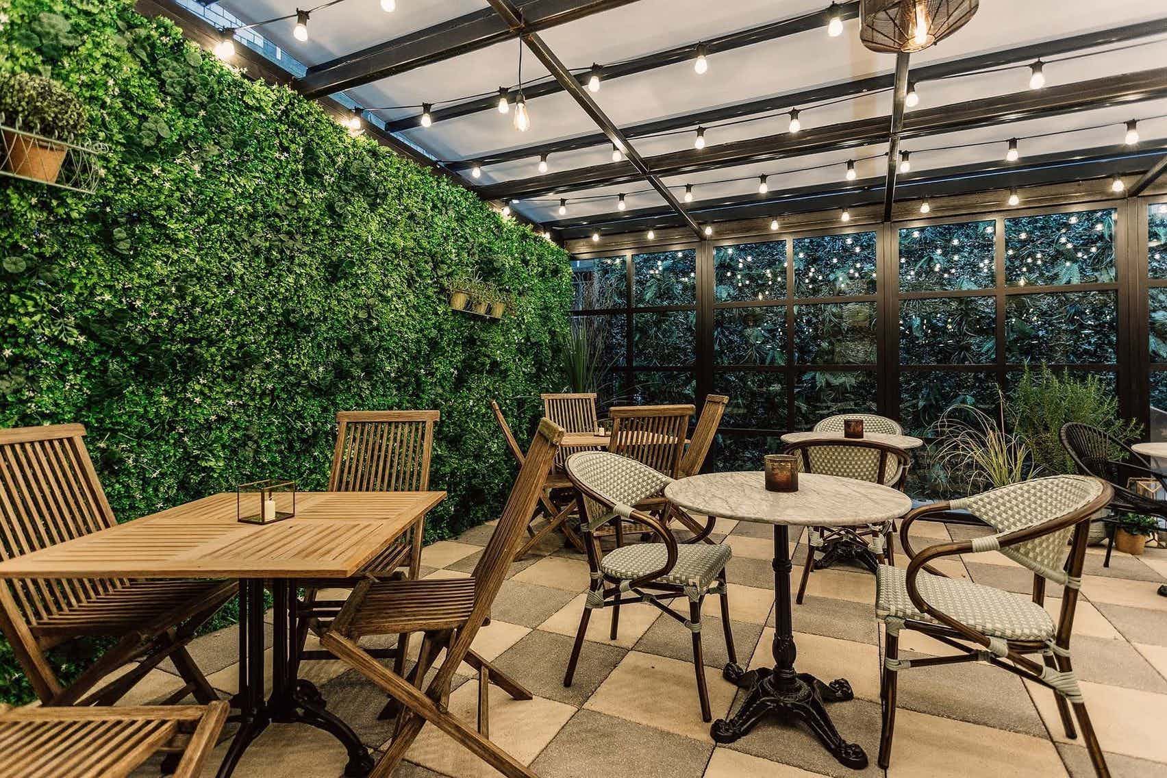 Glenfiddich Suite outdoor meeting space with lush greenery, ideal for networking events.