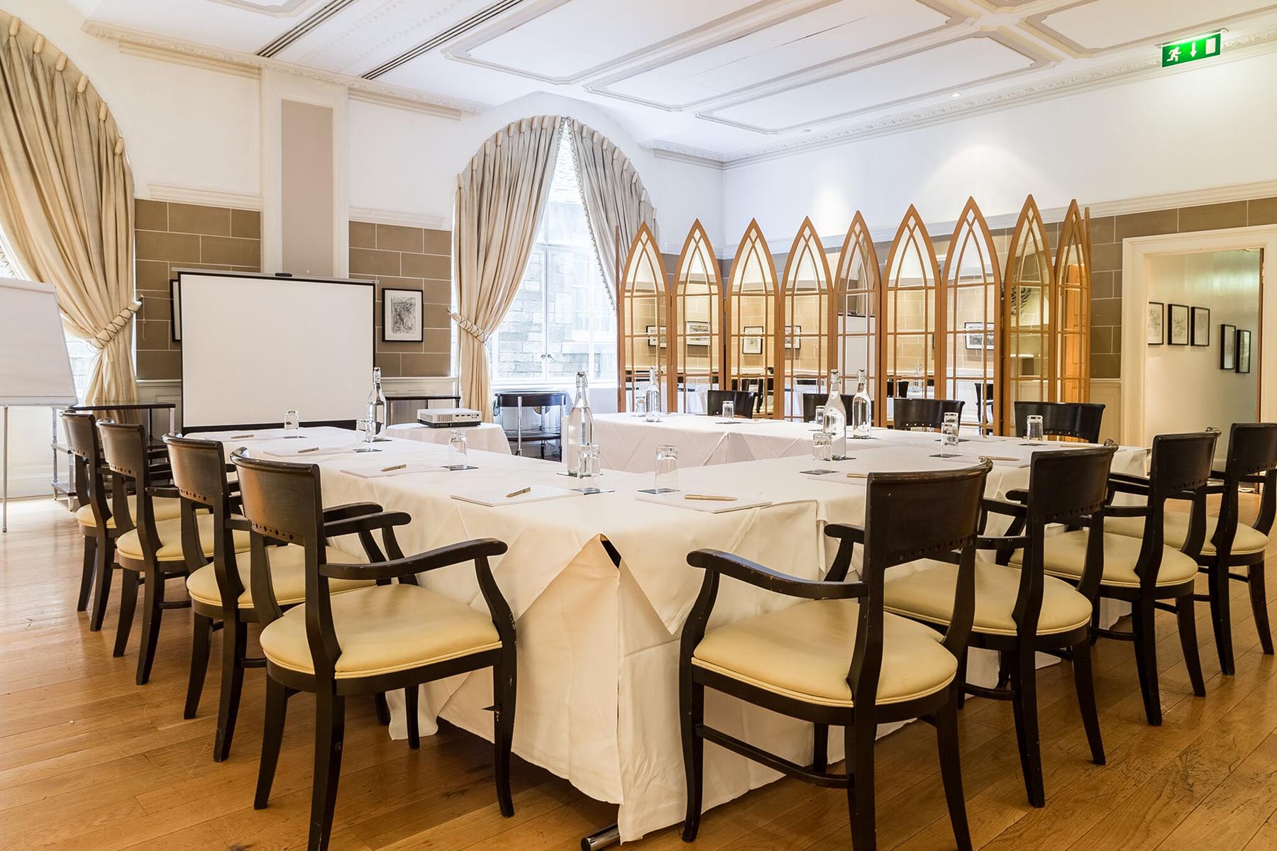 The Drawing Room at Scotsman Hotel: elegant meeting space with oval table for corporate events.