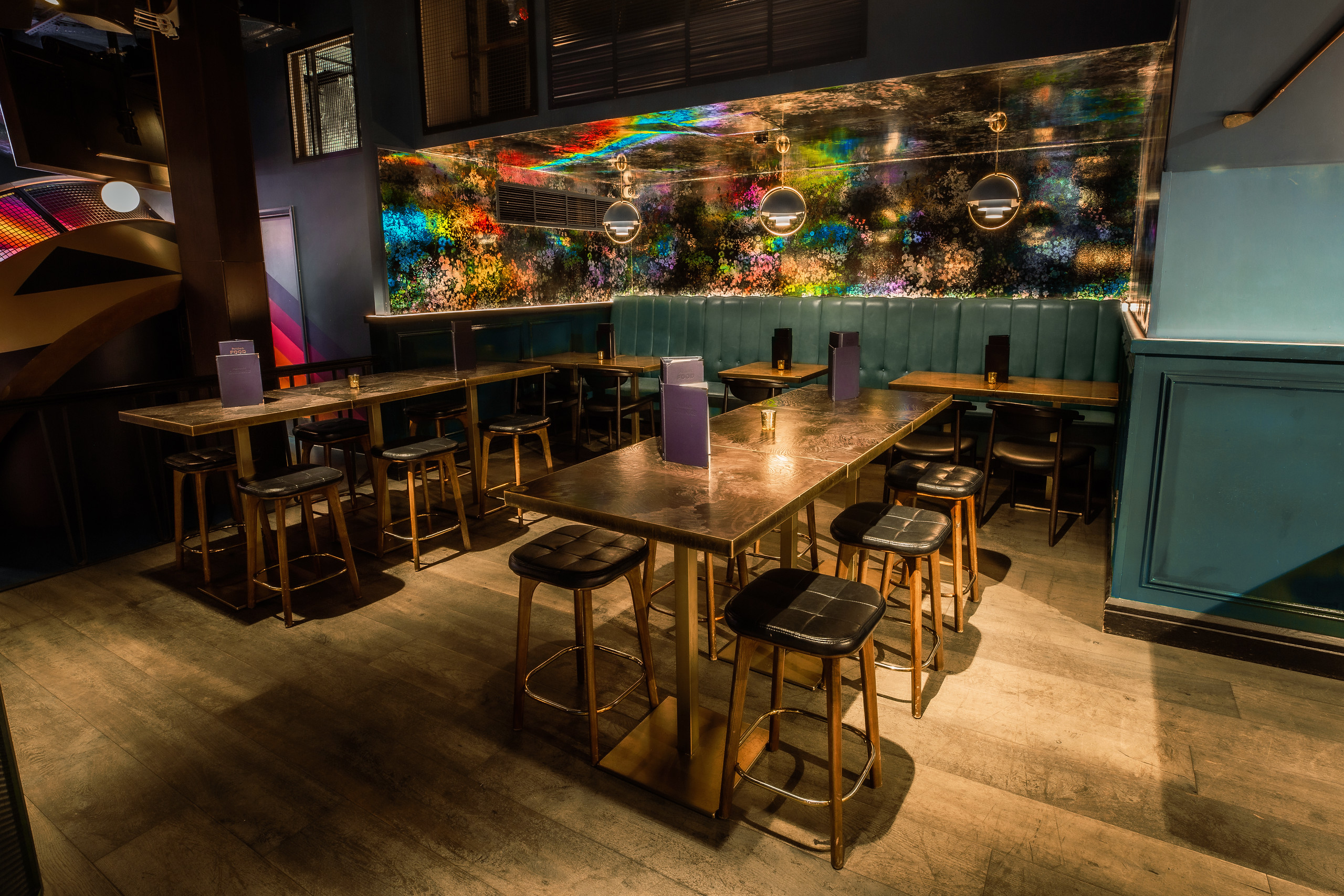 Sapphire Semi-Private Area at Puttshack Bank, modern seating for networking events.