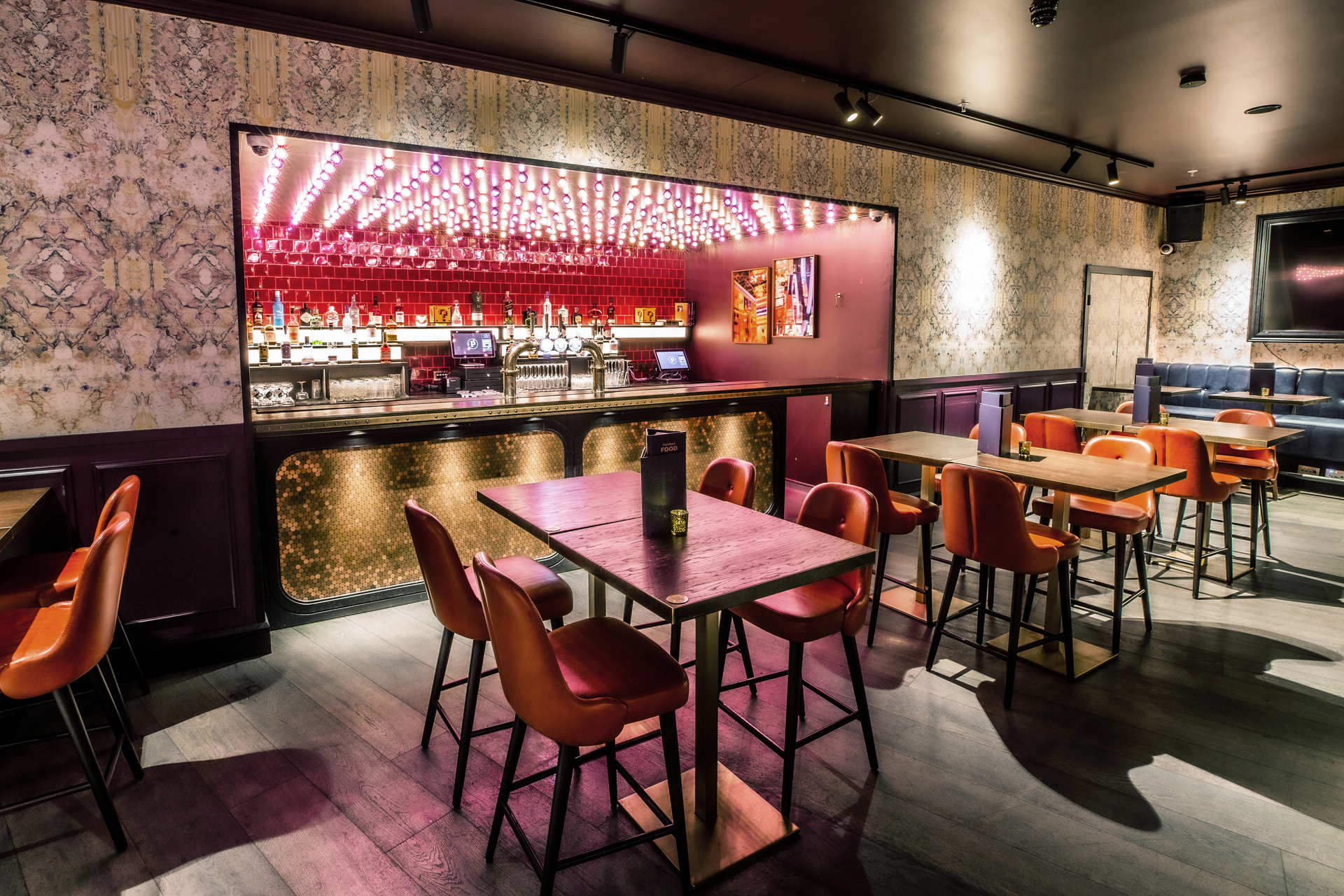 Ruby Rose Private Room at Puttshack Bank, stylish bar for intimate gatherings and events.