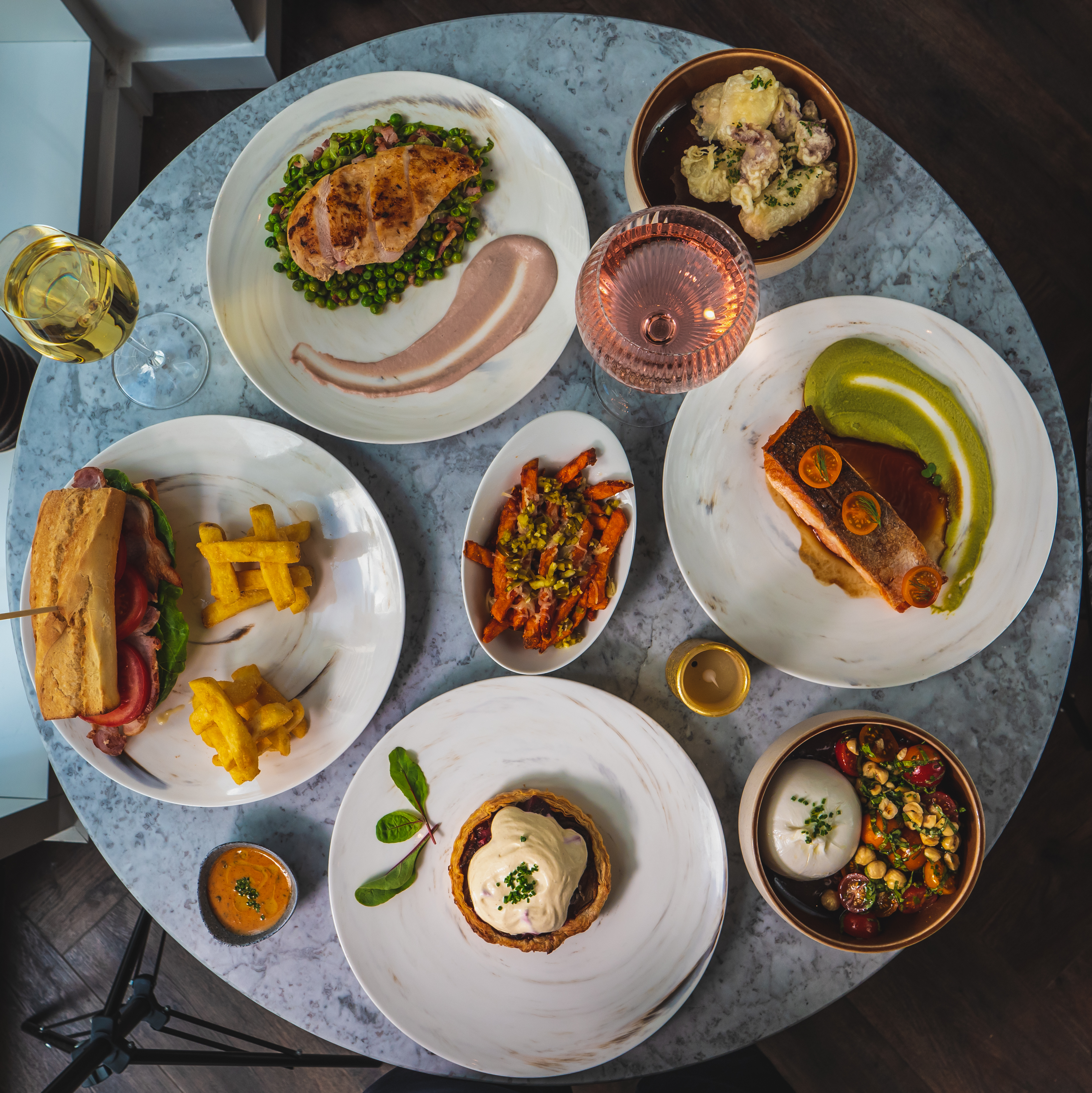 Elegant table setting with gourmet dishes for a high-end corporate dinner event.