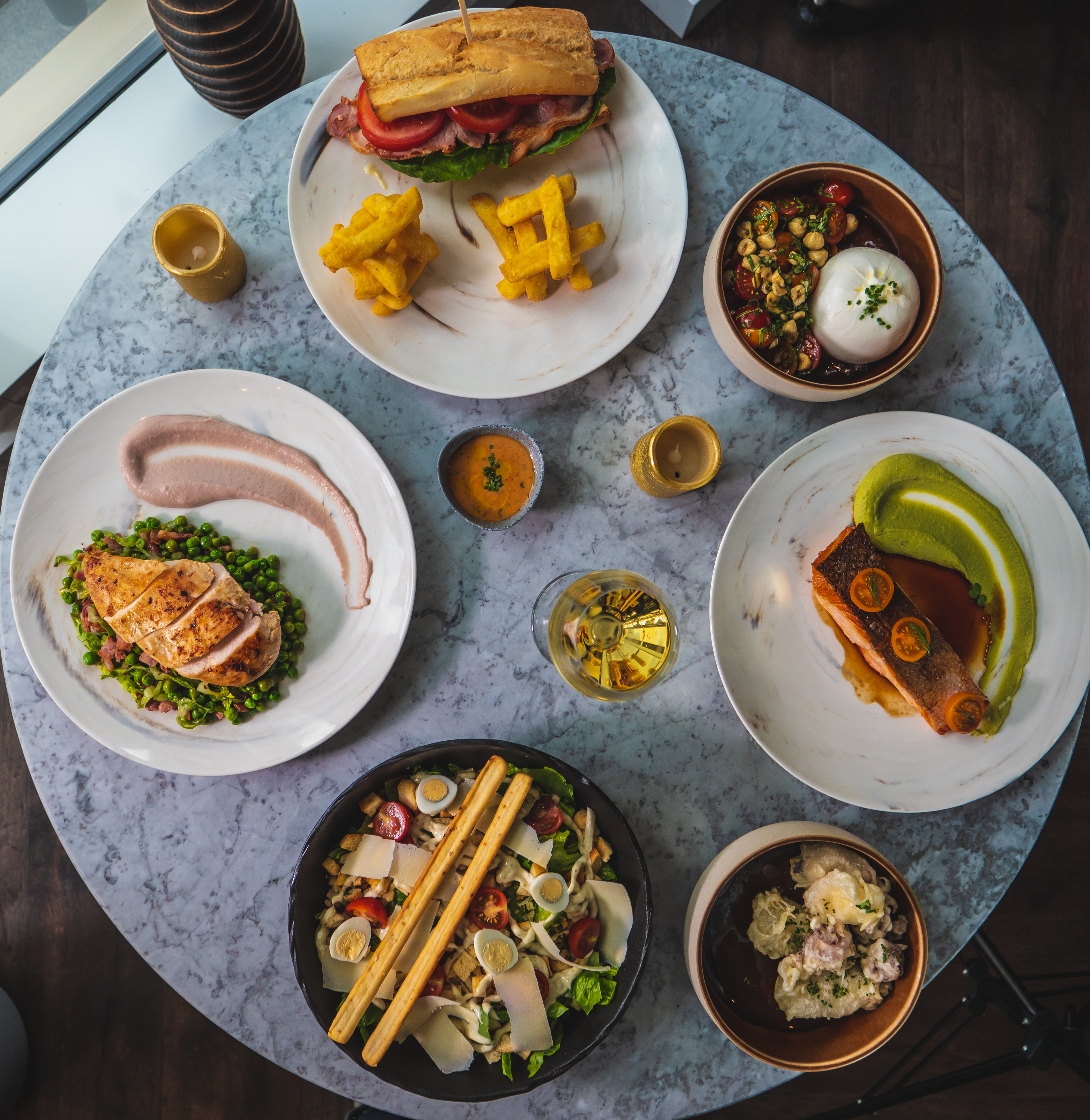 Elegant table setting with gourmet dishes for a corporate gala on Champagne Route.