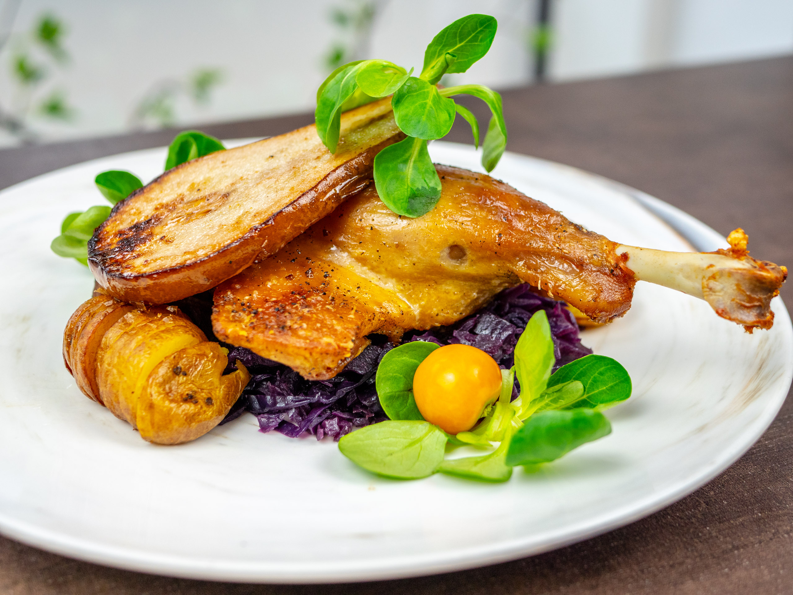 Elegant roasted chicken dish with vibrant vegetables at Champagne Route event.