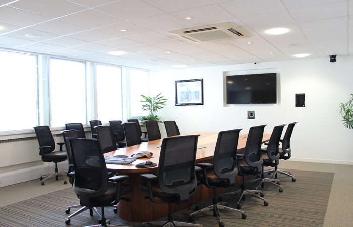 Modern conference room with ergonomic chairs, ideal for corporate meetings and events.