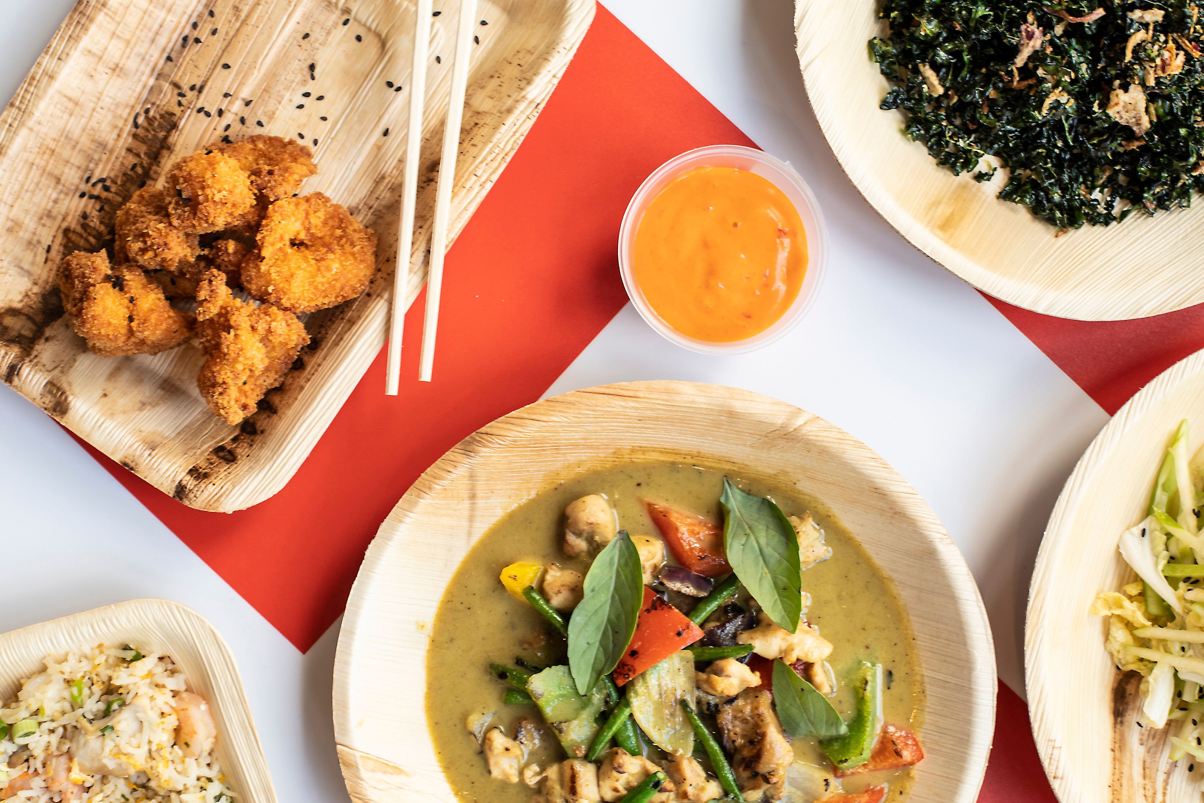 Vibrant catering dishes on eco-friendly plates for networking events at Chop Shop.