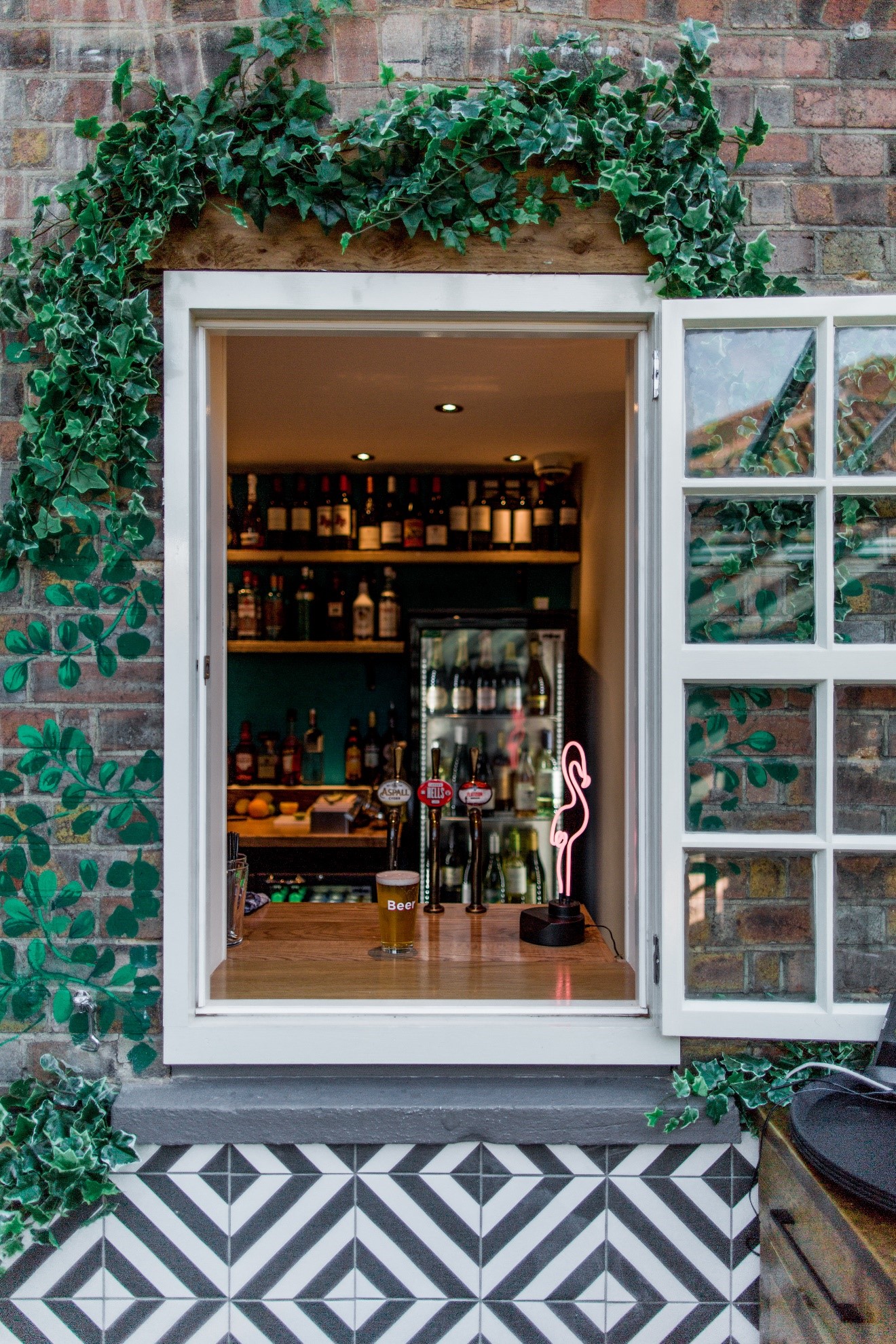 Charming bar setup at The Juniper Terrace, ideal for networking events with diverse drinks.