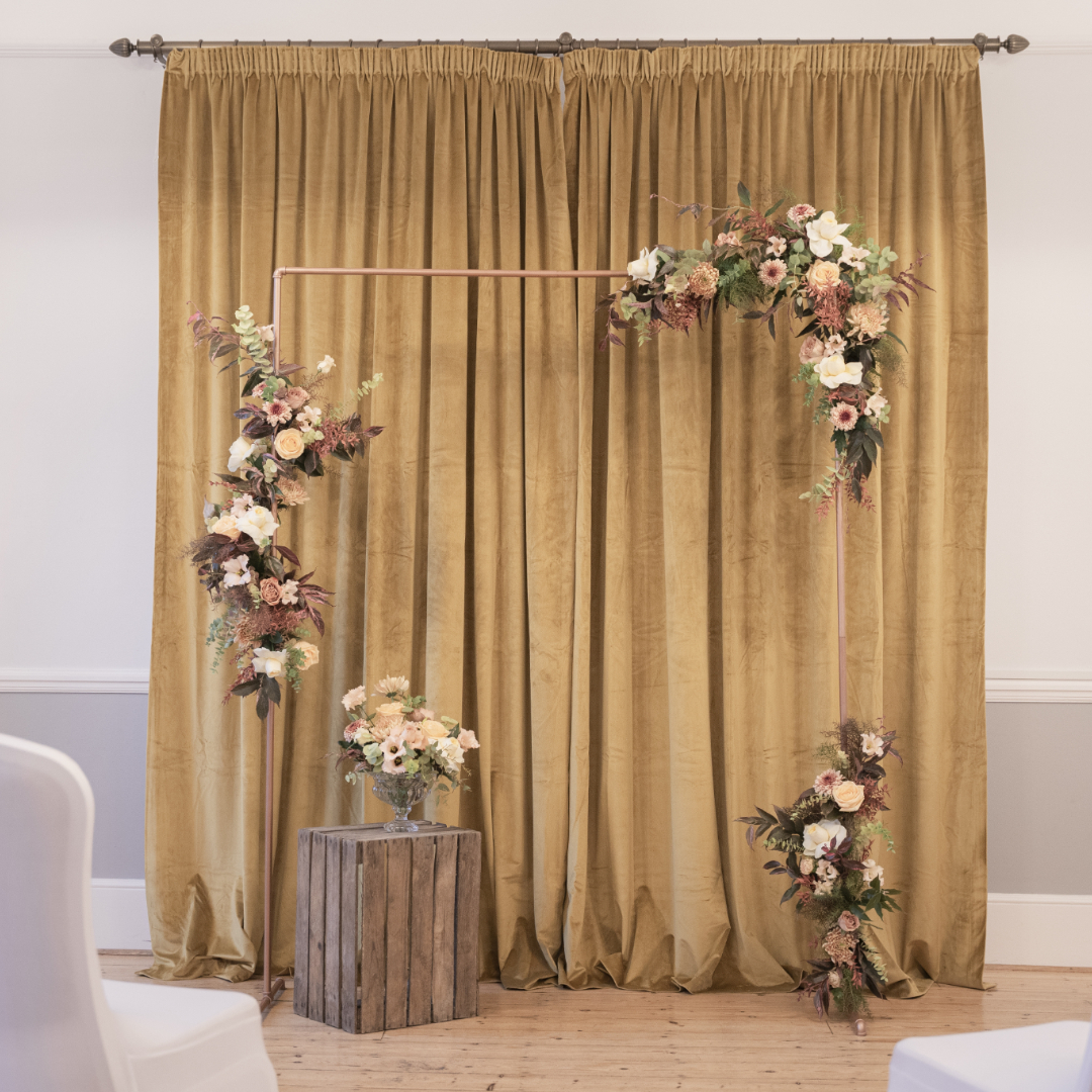 Floral arch in Captains Room, Linden House - elegant wedding backdrop for upscale events.