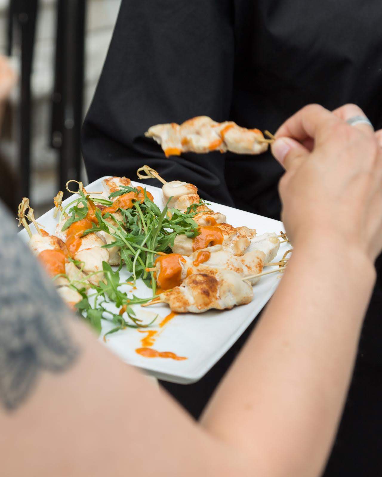 Captains Room platter: skewered chicken with vibrant sauce for events and catering.