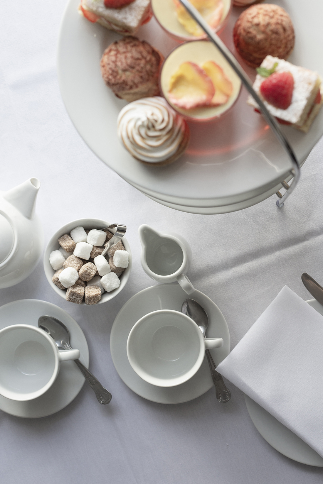 Elegant table setting with porcelain for high tea in Commodores Room, Linden House.
