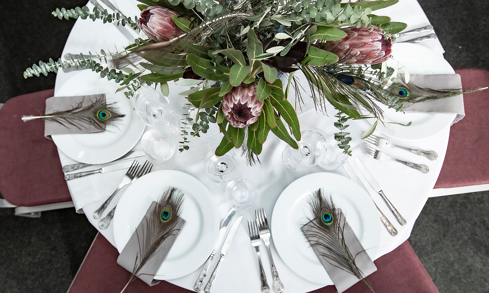 Elegant round table with protea flowers for upscale events at Commodores Room, Linden House.