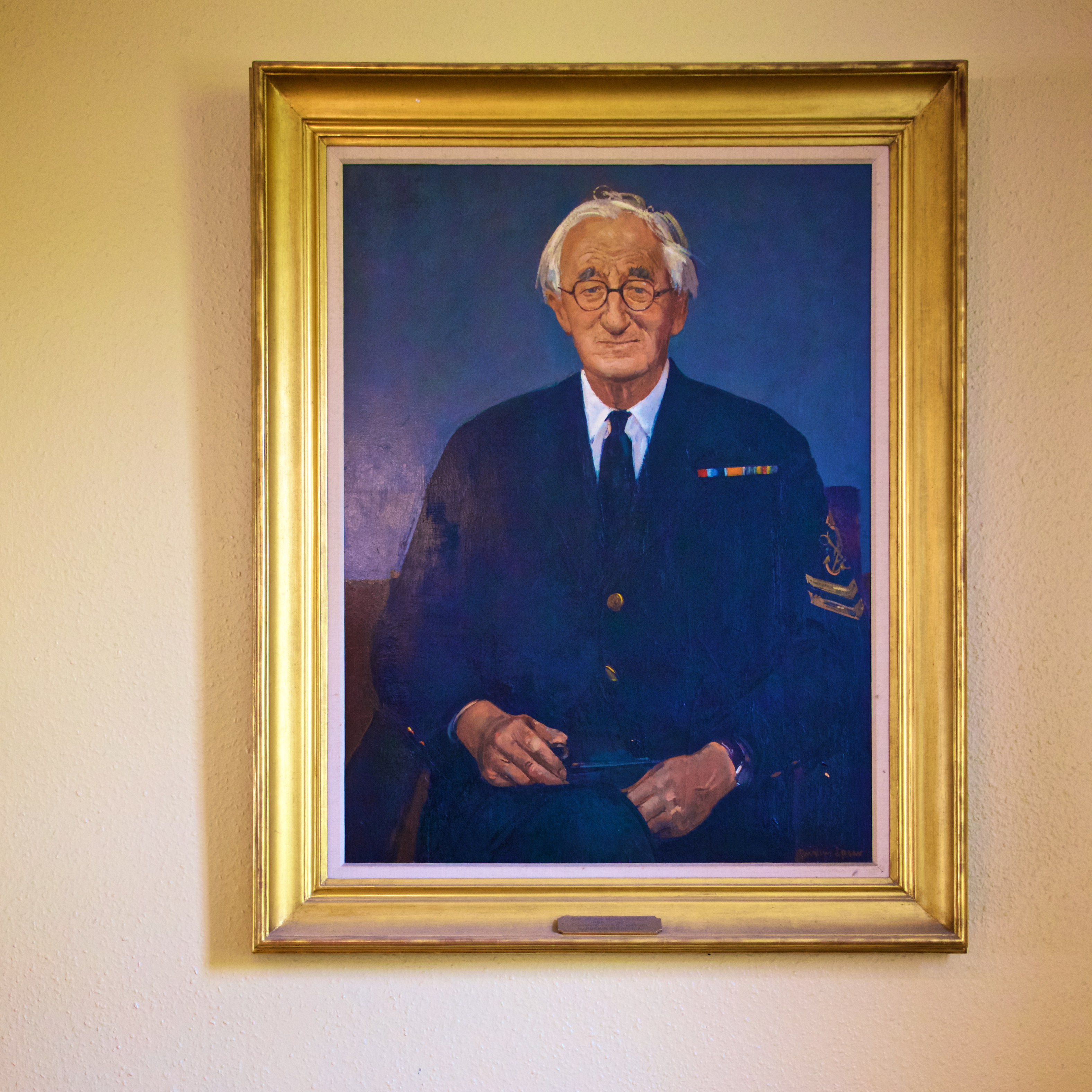 Framed military portrait in THE BOARDROOM, Linden House for impactful events.