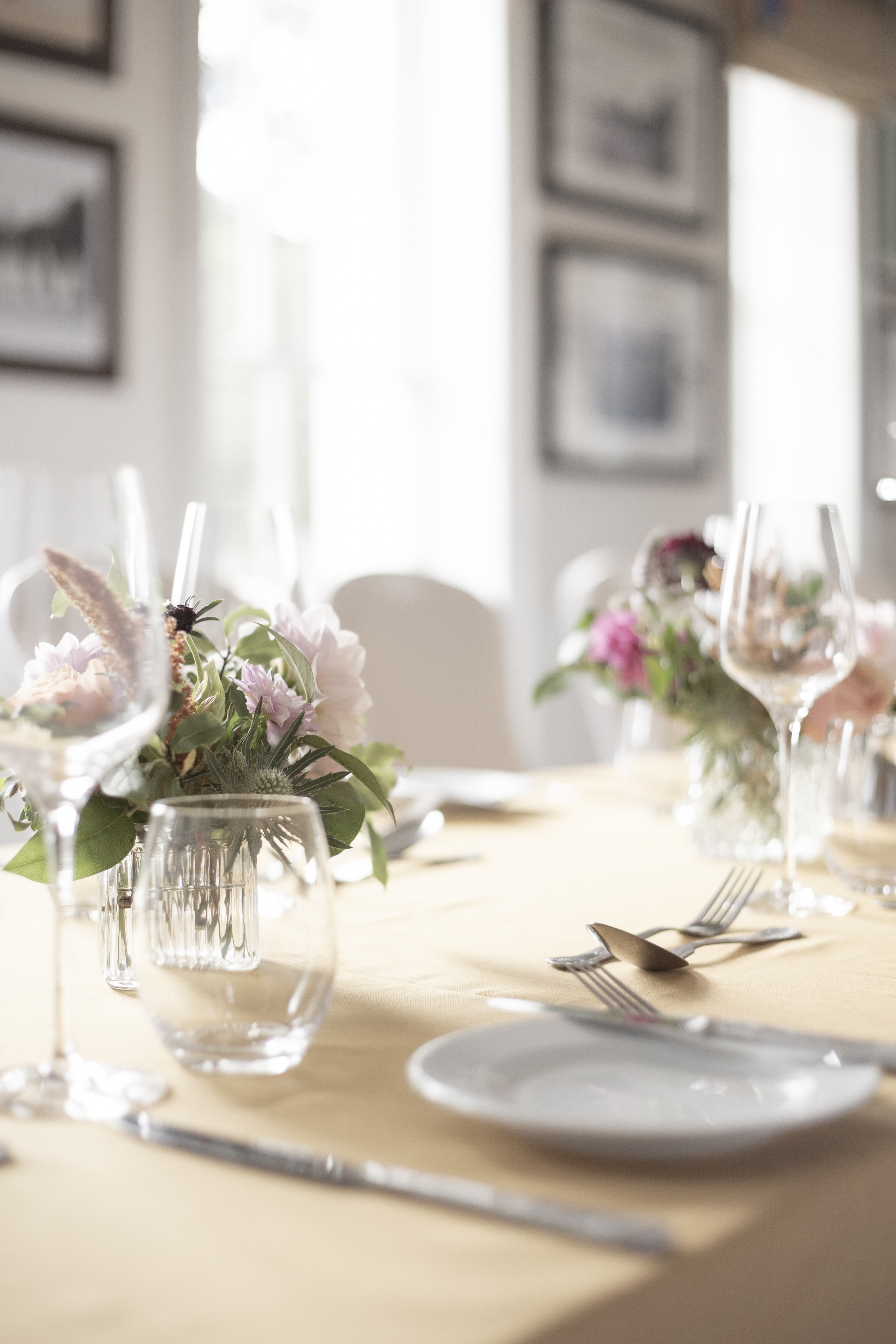 Elegant dining table with floral centerpieces in Linden House for weddings and corporate events.