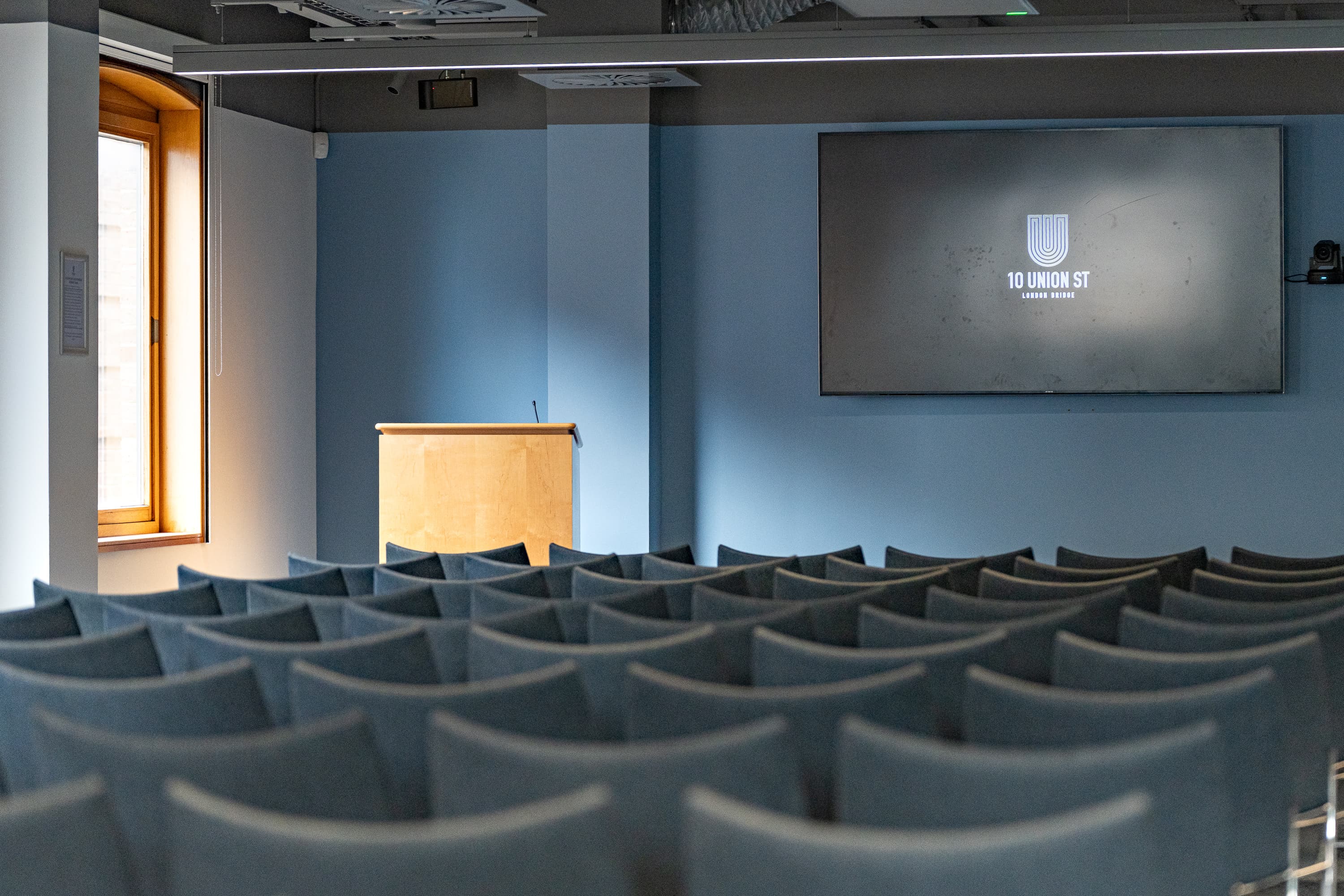 Theater-style seminar room at 10 Union Street with AV screen for corporate events and presentations.