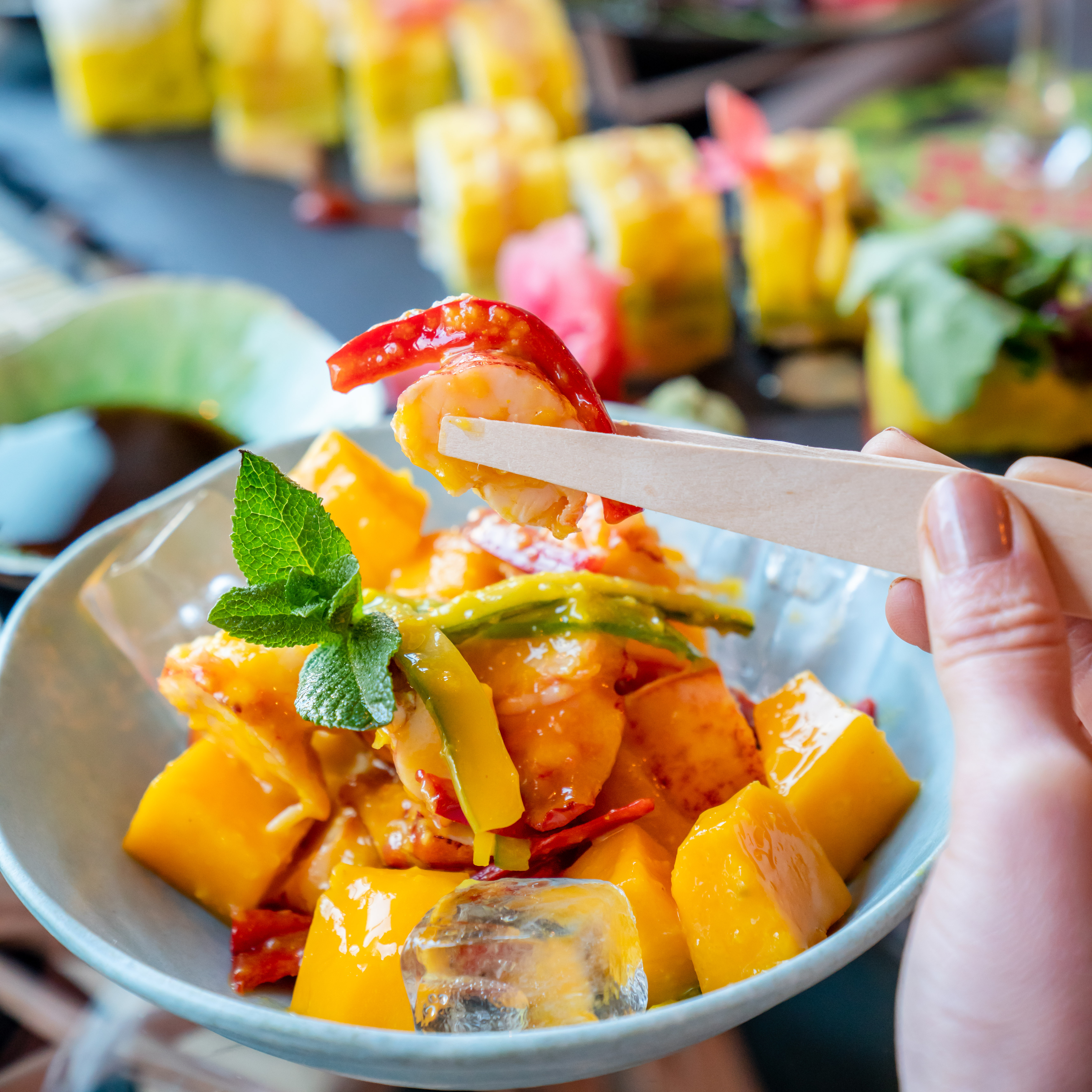 Vibrant shrimp and mango dish at Temakinho Tower Bridge for events and catering.