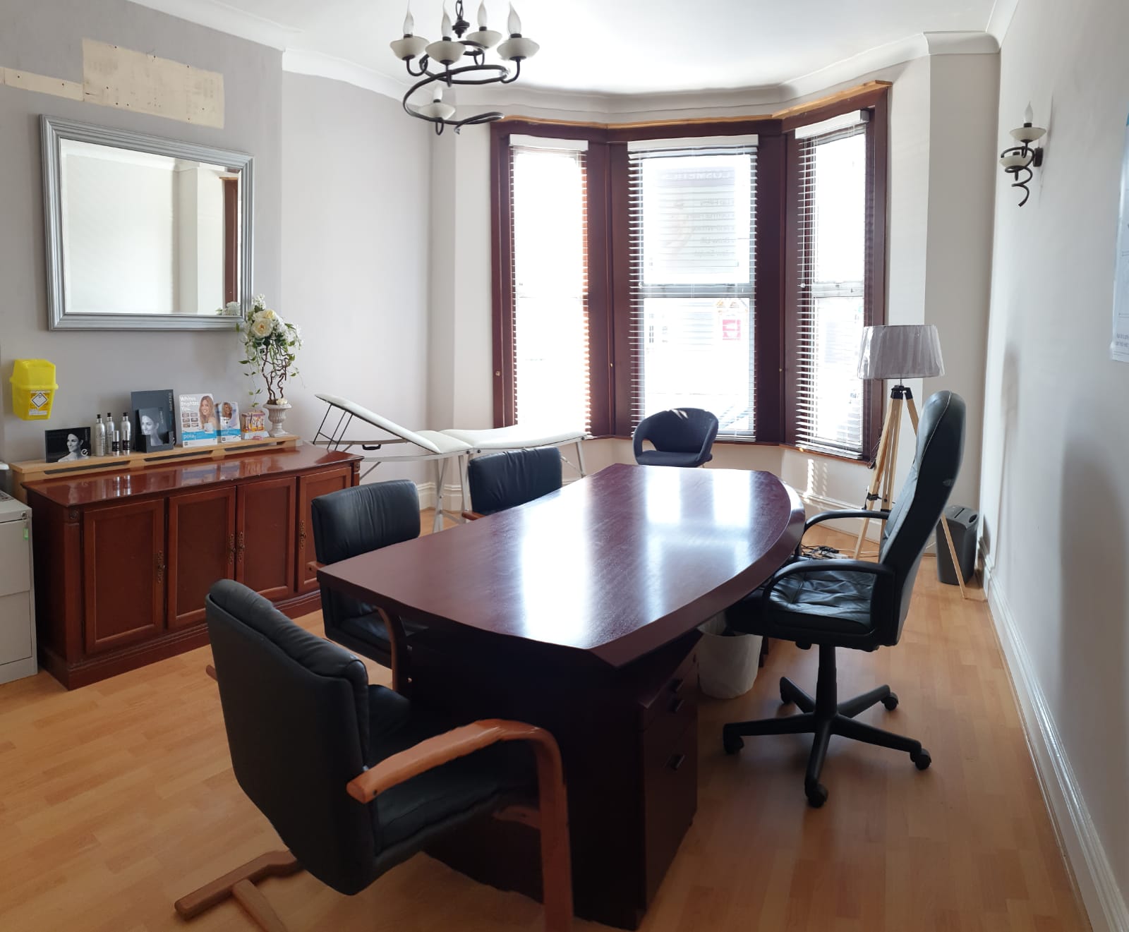 Consultation Room 1 at Best Health Clinics, featuring a large wooden table for meetings.