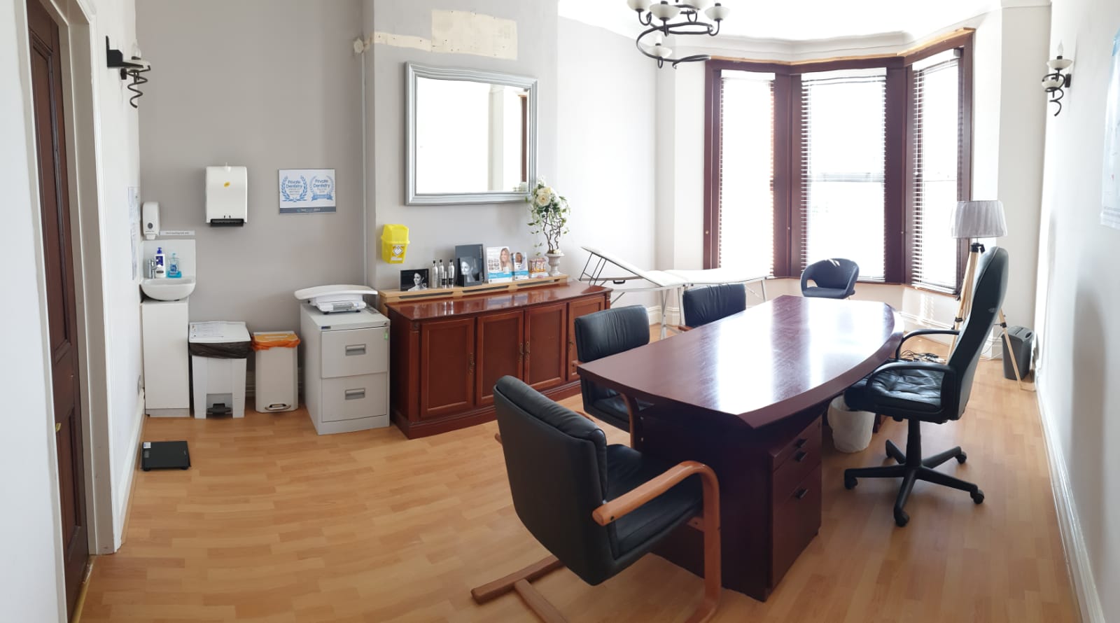 Consultation Room 1 at Best Health Clinics, featuring a large wooden table for meetings.