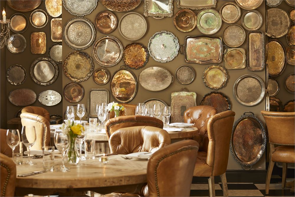 Stylish dining venue with vintage trays, ideal for upscale events and gatherings.