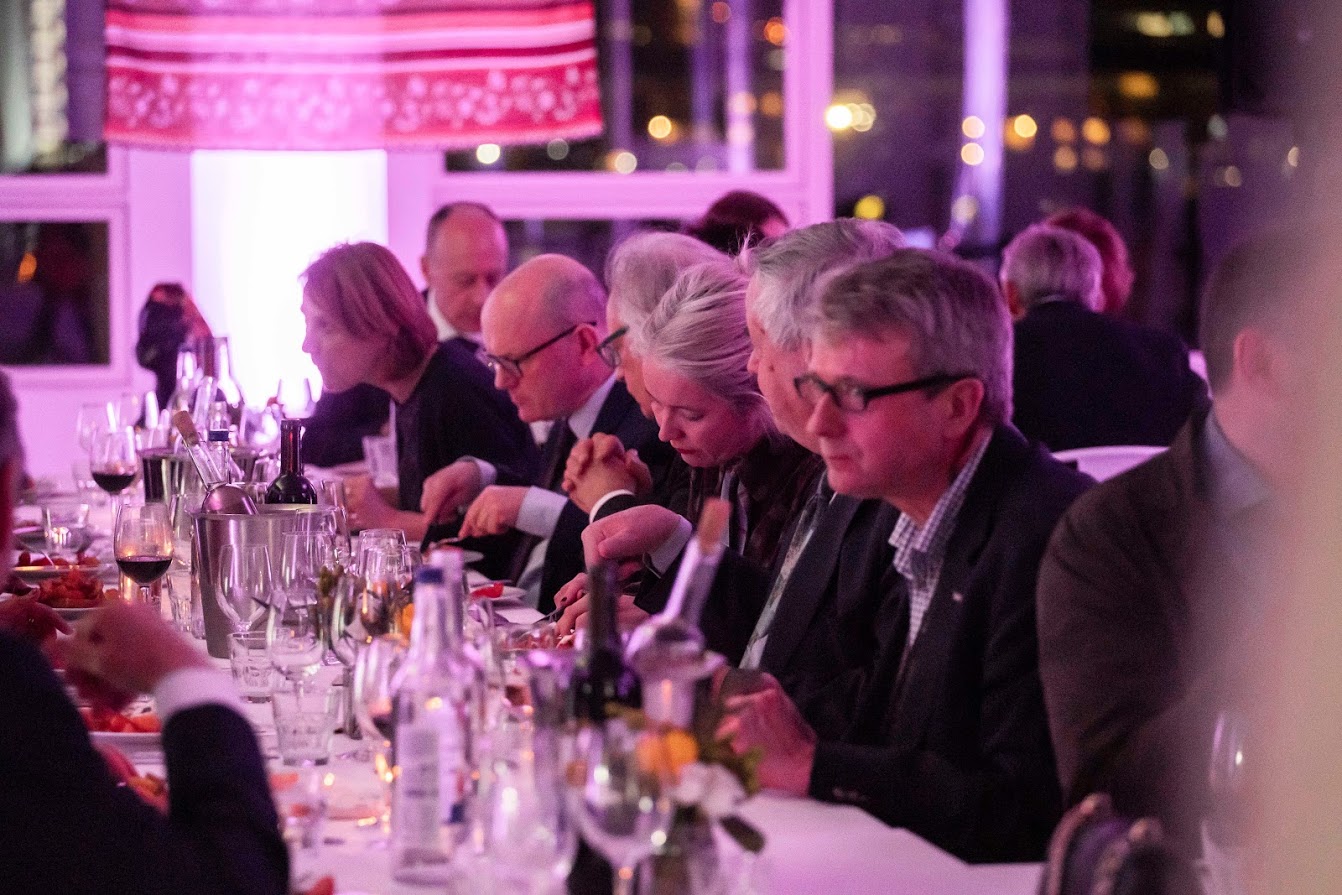 Elegant dinner event in Lockside Kitchen with sophisticated table settings and warm ambiance.