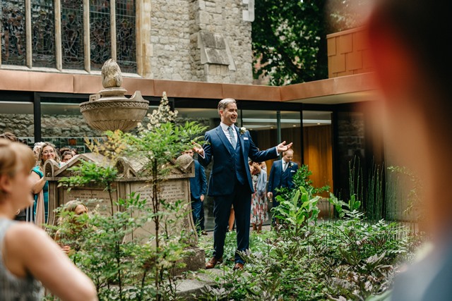 Outdoor event at The Garden Restaurant with greenery and historical architecture.