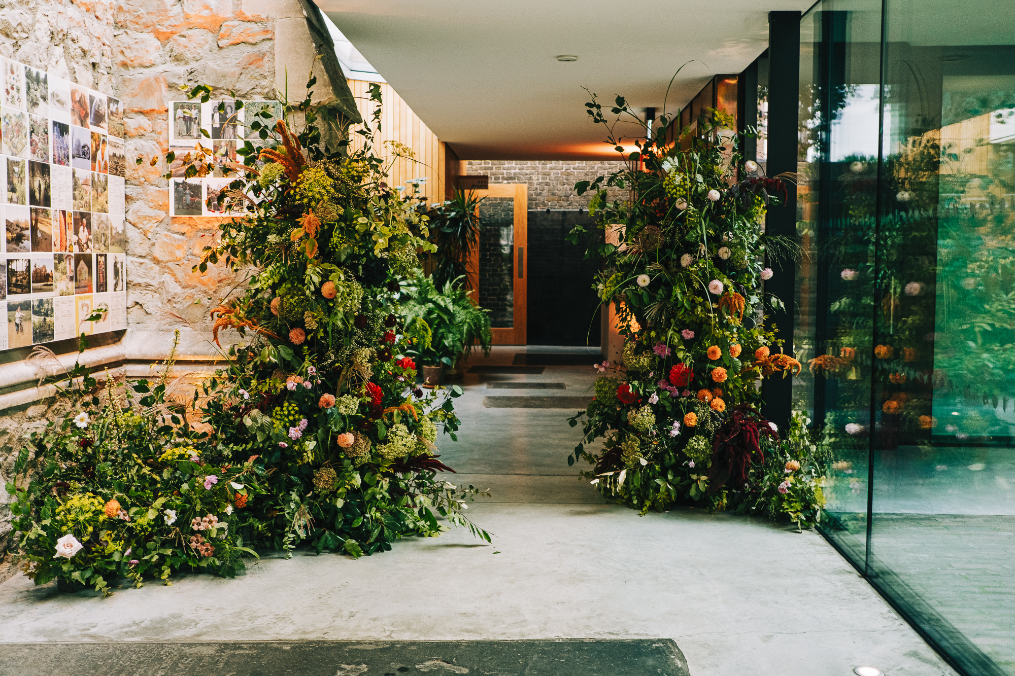 Garden Restaurant entrance with lush flowers, perfect for wellness events and nature gatherings.