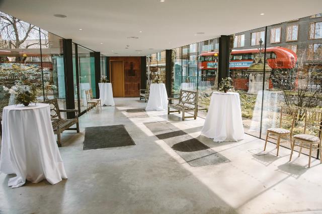 Stylish event space with high-top tables in Garden Museum for receptions and gatherings.