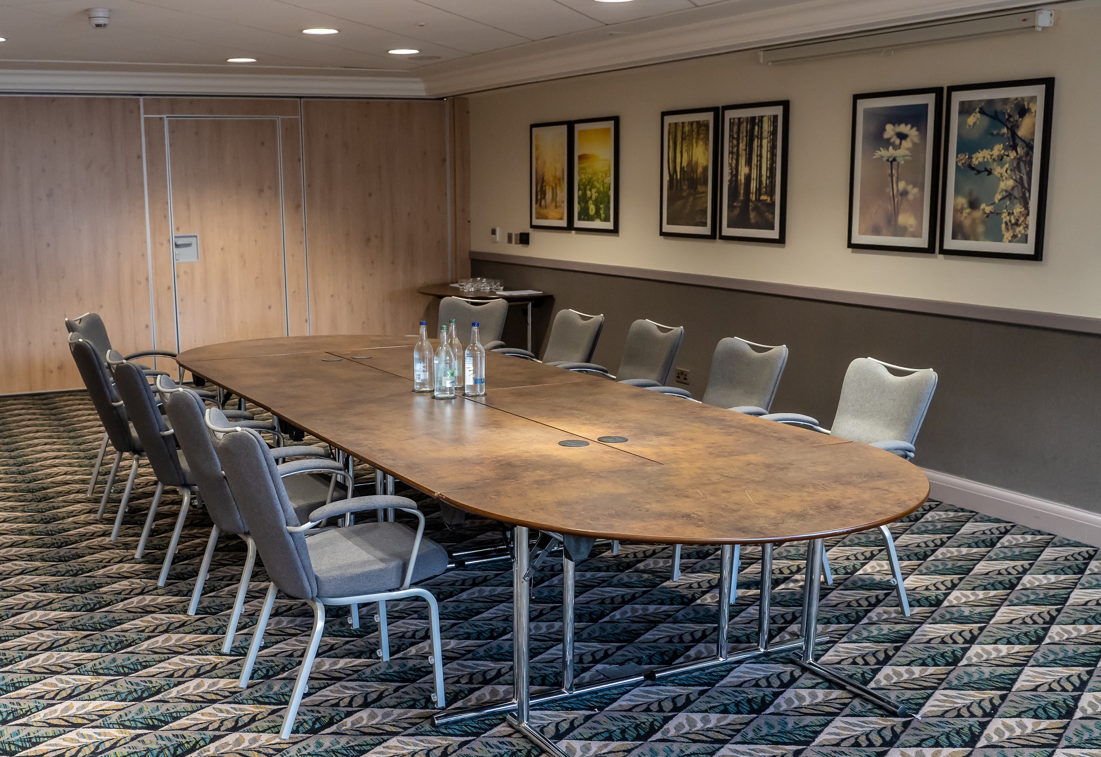 Oadby Suite meeting room with oval table, ideal for corporate events and workshops.
