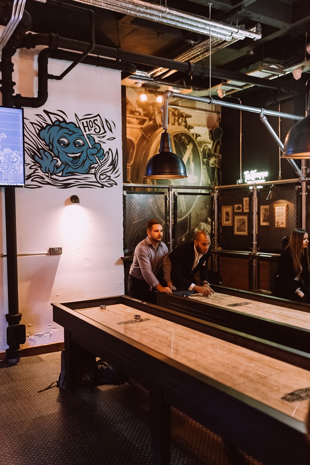 Games Room at Head of Steam: shuffleboard networking event in a vibrant venue.