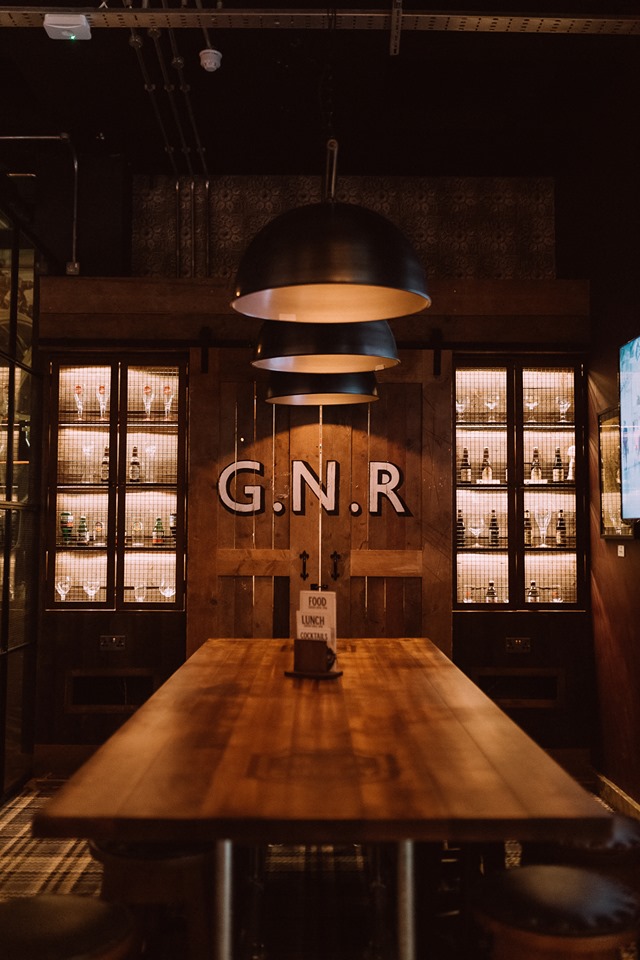 Stylish tasting room with rustic decor, ideal for upscale events and private gatherings.