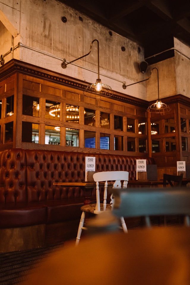 Cozy booth dining area at The Fireplace, ideal for exclusive events and meetings.